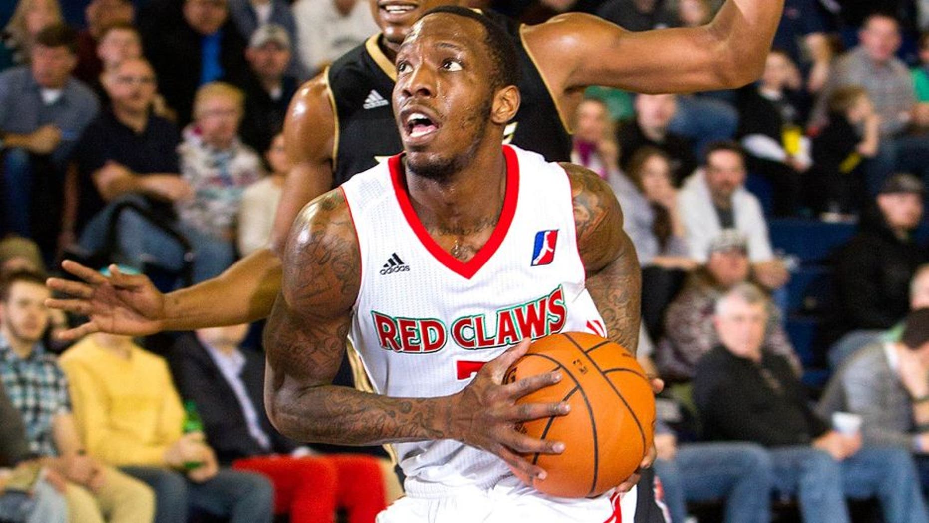 PORTLAND, ME - MARCH 16: Tyshawn Taylor #7 of the Maine Red Claws drives against the Erie BayHawks on March 16, 2014 at the Portland Expo in Portland, Maine. NOTE TO USER: User expressly acknowledges and agrees that, by downloading and/or using this photograph, user is consenting to the terms and conditions of the Getty Images License Agreement. Mandatory Copyright Notice: Copyright 2014 NBAE (Photo by Rich Obrey/NBAE via Getty Images)