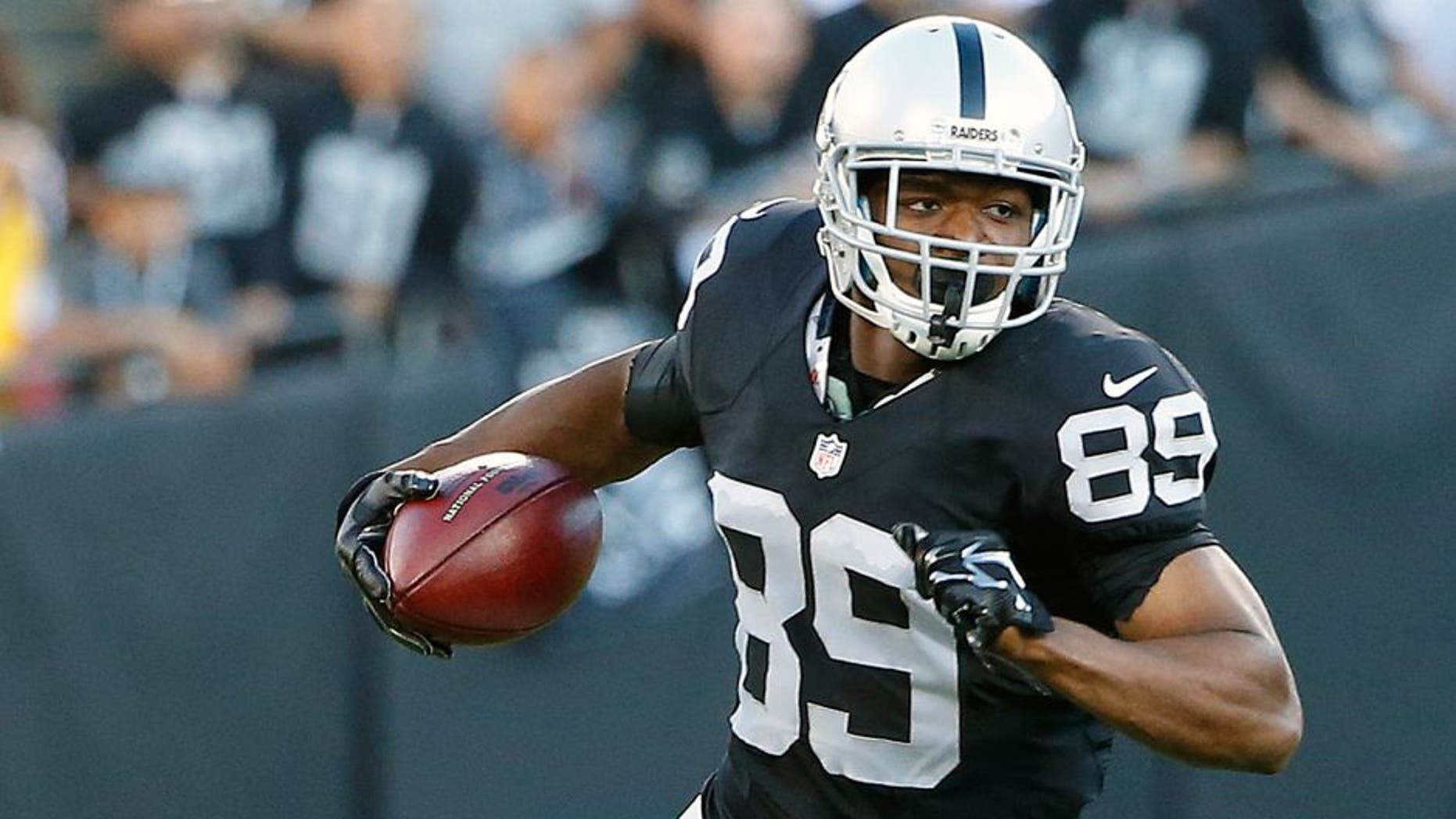 Oakland Raiders wide receiver Amari Cooper (89) runs against the St. Louis Rams during the first half of an NFL preseason football game in Oakland, Calif., Friday, Aug. 14, 2015. (AP Photo/Tony Avelar)