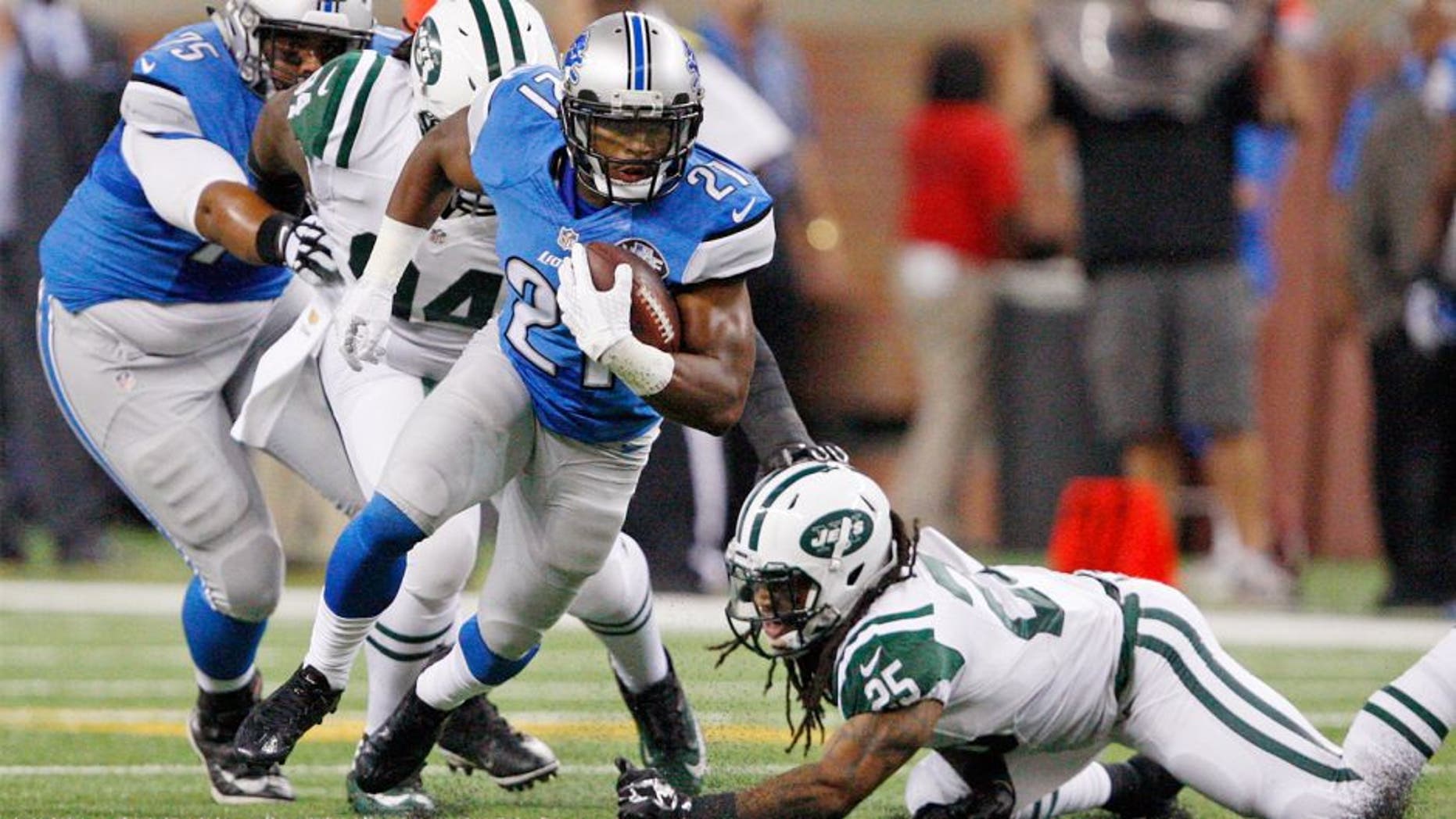Aug 13, 2015; Detroit, MI, USA; Detroit Lions running back Ameer Abdullah (21) evades a tackle from New York Jets free safety Calvin Pryor (25) during the first quarter of a preseason NFL football game at Ford Field. Mandatory Credit: Raj Mehta-USA TODAY Sports