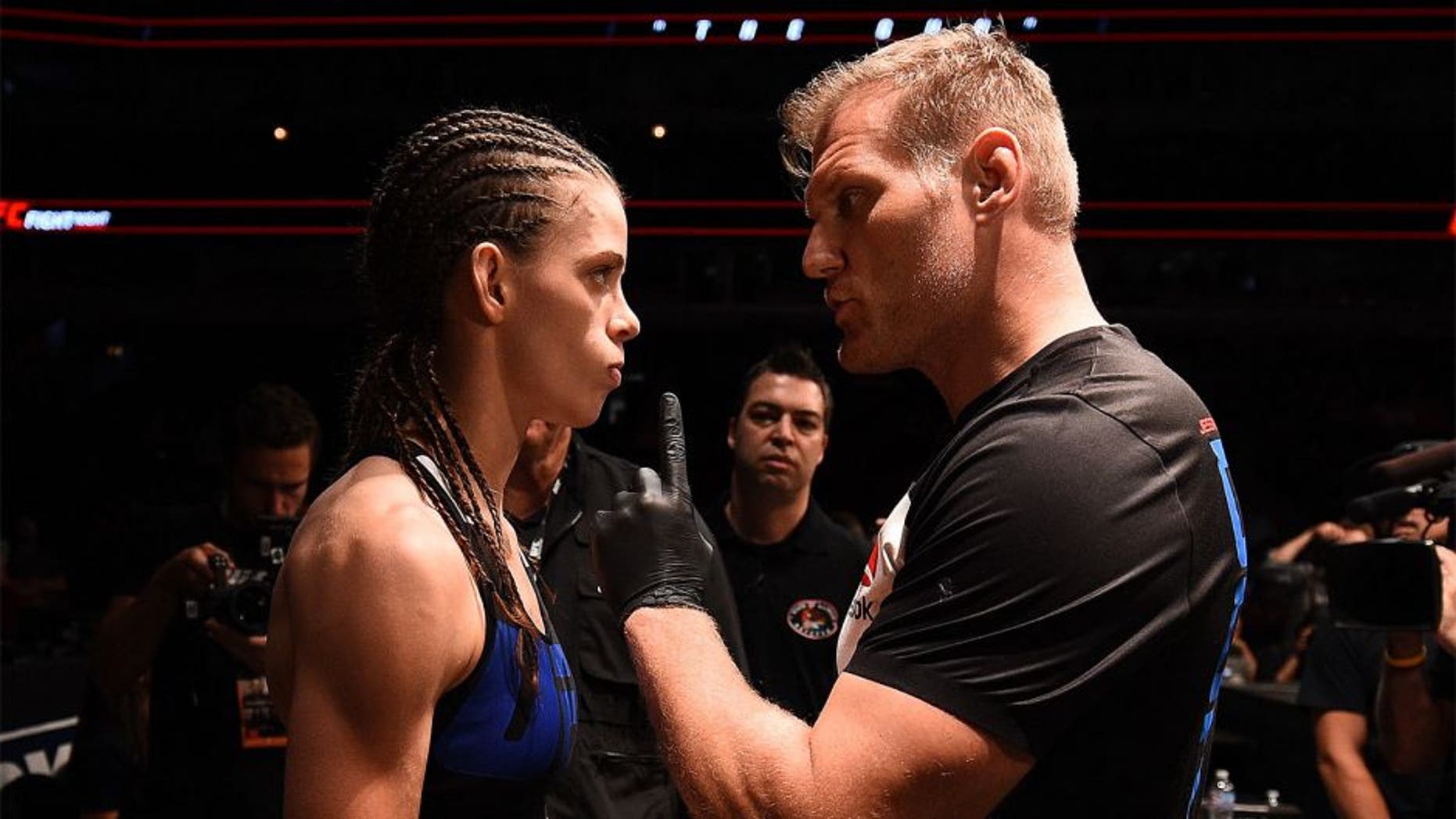 CHICAGO, IL - JULY 25: Jessamyn Duke (L) receives instructions from coach Josh Barnett before her women's bantamweight bout against Elizabeth Phillips during the UFC event at the United Center on July 25, 2015 in Chicago, Illinois. (Photo by Jeff Bottari/Zuffa LLC/Zuffa LLC via Getty Images)