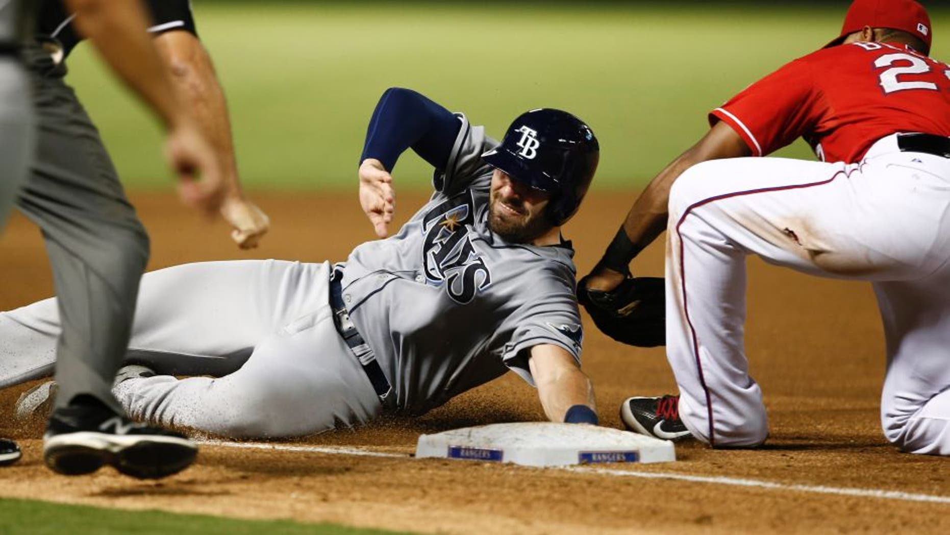Aug 14, 2015; Arlington, TX, USA; Texas Rangers third baseman Adrian Beltre (29) tags out Tampa Bay Rays catcher Curt Casali (19) during the seventh inning of a baseball game at Globe Life Park in Arlington. The Rangers won 5-3. Mandatory Credit: Jim Cowsert-USA TODAY Sports
