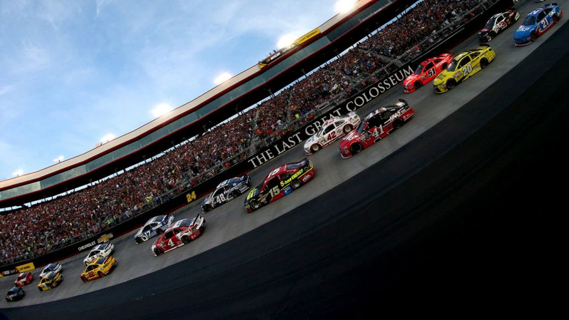 BRISTOL, TN - AUGUST 22: Denny Hamlin, driver of the #11 FedEx Ground Toyota, and Kyle Busch, driver of the #18 Skittles Toyota, lead the field at the start of the NASCAR Sprint Cup Series IRWIN Tools Night Race at Bristol Motor Speedway on August 22, 2015 in Bristol, Tennessee. (Photo by Sean Gardner/Getty Images)