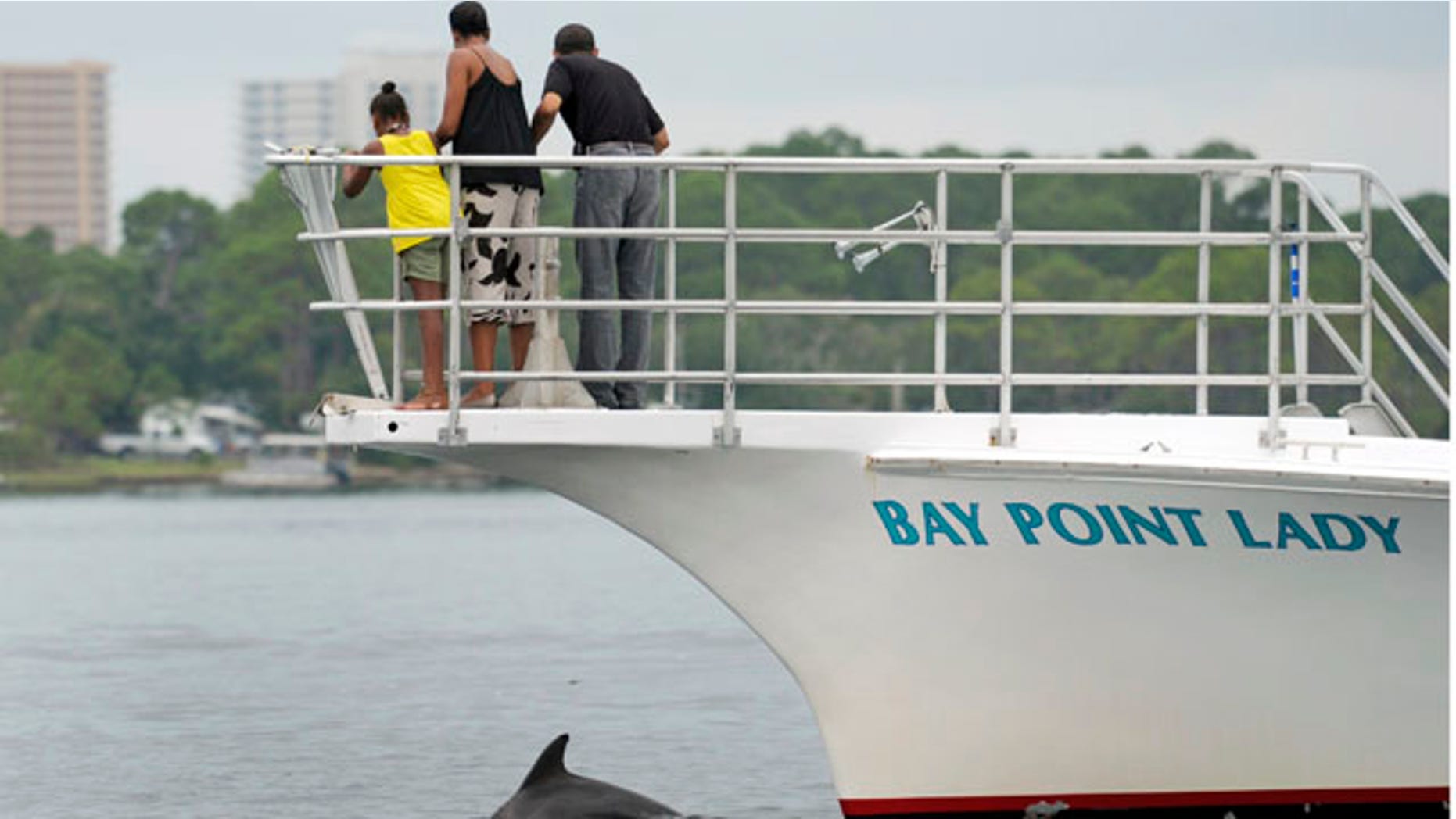 Aug. 15: President Obama, first lady Michelle Obama, and their daughter Sasha watch a porpoise as they take a boat ride in St. Andrews Bay in Panama City Beach, Fla.