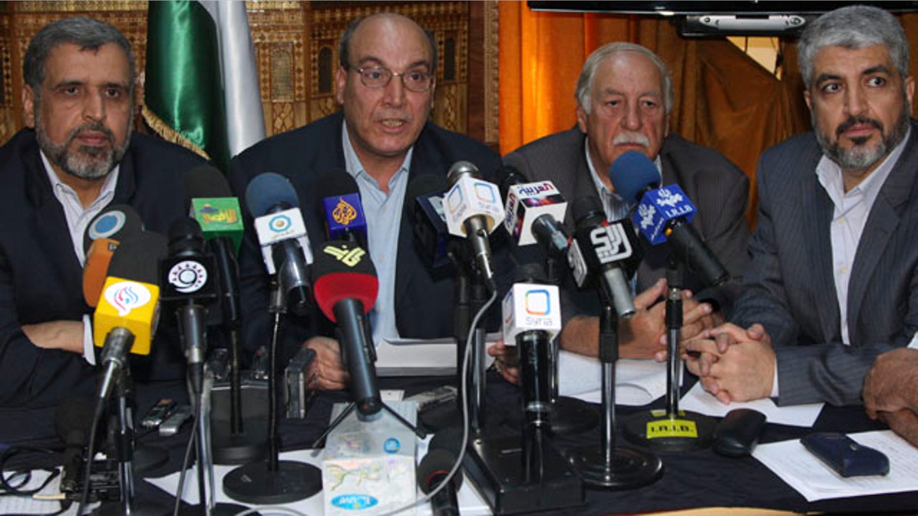 Aug. 15: Eleven Damascus-based opposition Palestinian groups gather in Damascus, Syria, to agree on a united stance towards direct negotiations between Israel and the Palestinian Authority, with from the right, Khaled Mashaal, head of Hamas politburo; Ahmed Jibril, the Popular Front for the Liberation of Palestine General Command; Maher Taher, the Popular Front for the Liberation of Palestine's representative in Damascus; and Ramadan Shallah, the secretary general of the Islamic Jihad leader.