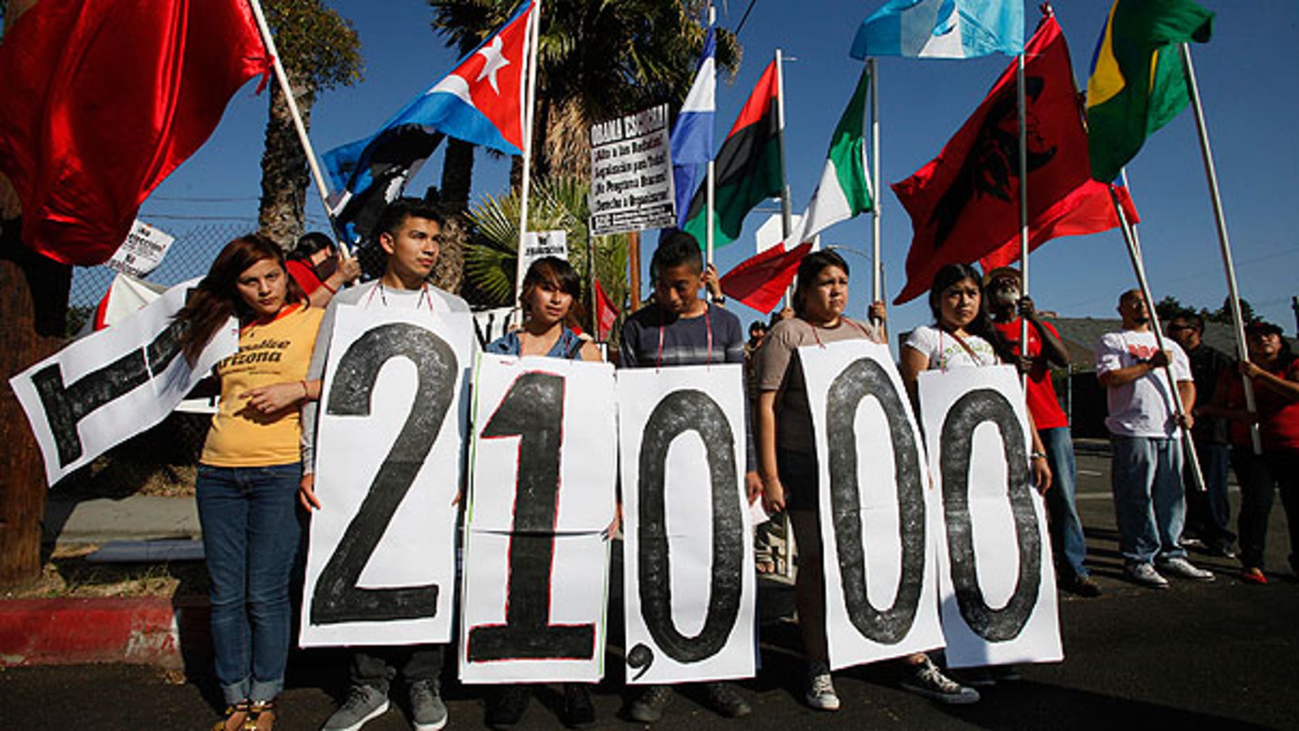 Aug. 15: Immigrant rights groups and community members rally in Los Angeles for an end to the Department of Homeland Security's (DHS) Secure Communities Program, which was created in 2008 and calls for police to submit suspects' fingerprints to DHS so they can be cross-checked with federal deportation orders.