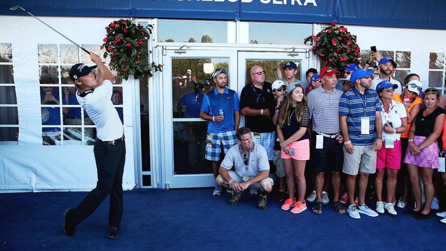 SHEBOYGAN, WI - AUGUST 15: Matt Jones of Australia plays his second shot from the carpet of a hospitality tent during the third round of the 2015 PGA Championship at Whistling Straits at on August 15, 2015 in Sheboygan, Wisconsin. (Photo by Andrew Redington/Getty Images)