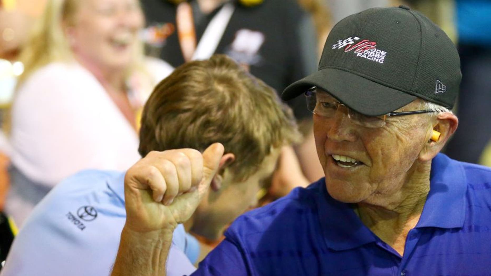 CHARLOTTE, NC - MAY 24: Team owner Joe Gibbs celebrates after Carl Edwards, driver of the #19 Subway Toyota, wins the NASCAR Sprint Cup Series Coca-Cola 600 at Charlotte Motor Speedway on May 24, 2015 in Charlotte, North Carolina. (Photo by Sarah Crabill/NASCAR via Getty Images)