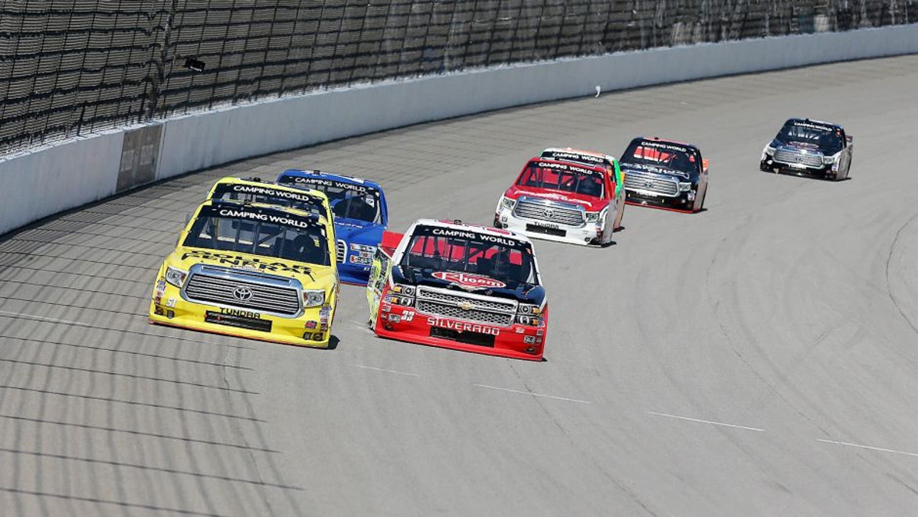 BROOKLYN, MI - AUGUST 15: Kyle Busch, driver of the #51 Dollar General Toyota, races Austin Dillon, driver of the #33 Rheem/Young Supply Company Chevrolet, during the NASCAR Camping World Truck Series Careers for Veterans 200 at Michigan International Speedway on August 15, 2015 in Brooklyn, Michigan. (Photo by Nick Laham/NASCAR via Getty Images)