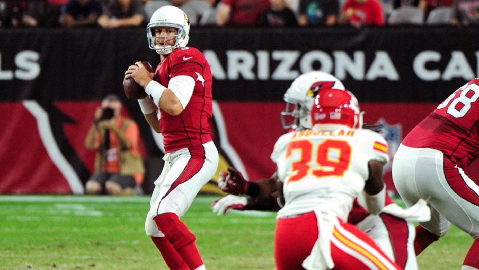 Aug 15, 2015; Glendale, AZ, USA; Arizona Cardinals quarterback Carson Palmer (3) looks to pass during the first half against the Kansas City Chiefs in a preseason NFL football game at University of Phoenix Stadium. Mandatory Credit: Matt Kartozian-USA TODAY Sports