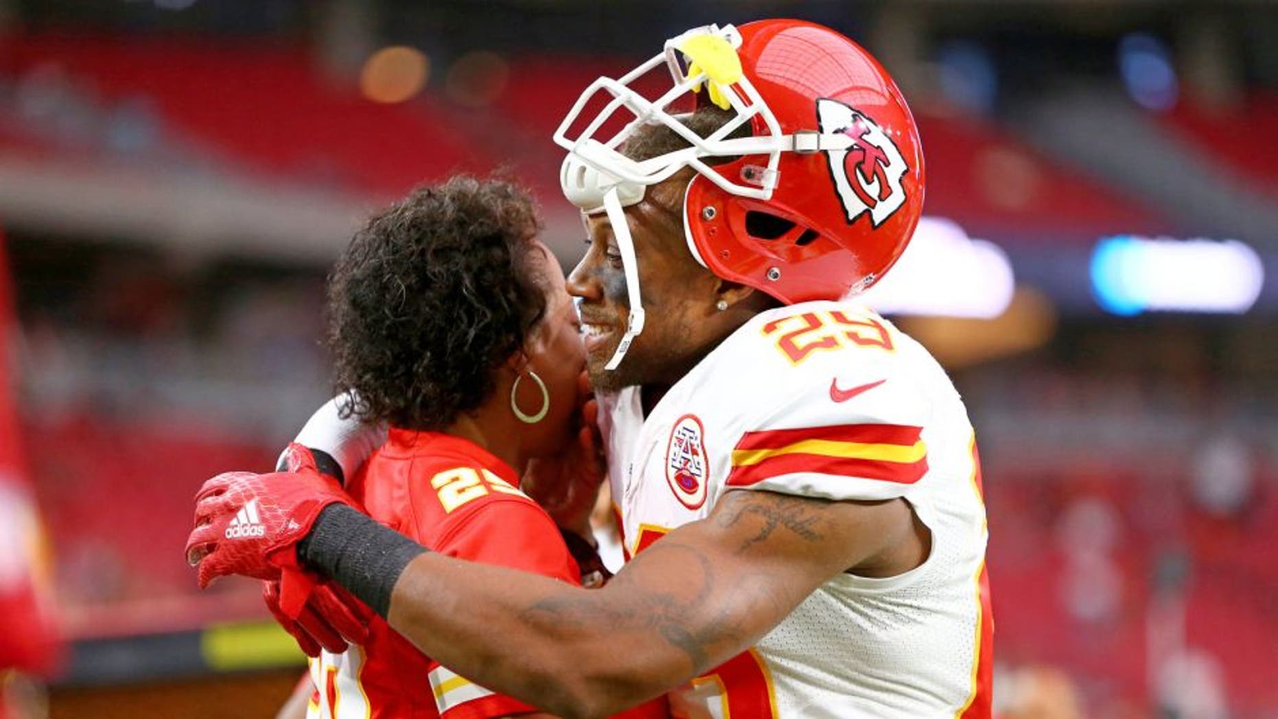 Aug 15, 2015; Glendale, AZ, USA; Kansas City Chiefs defensive back Eric Berry (29) hugs his mother Carol Berry prior to the game against the Arizona Cardinals in a preseason NFL football game at University of Phoenix Stadium. Mandatory Credit: Mark J. Rebilas-USA TODAY Sports