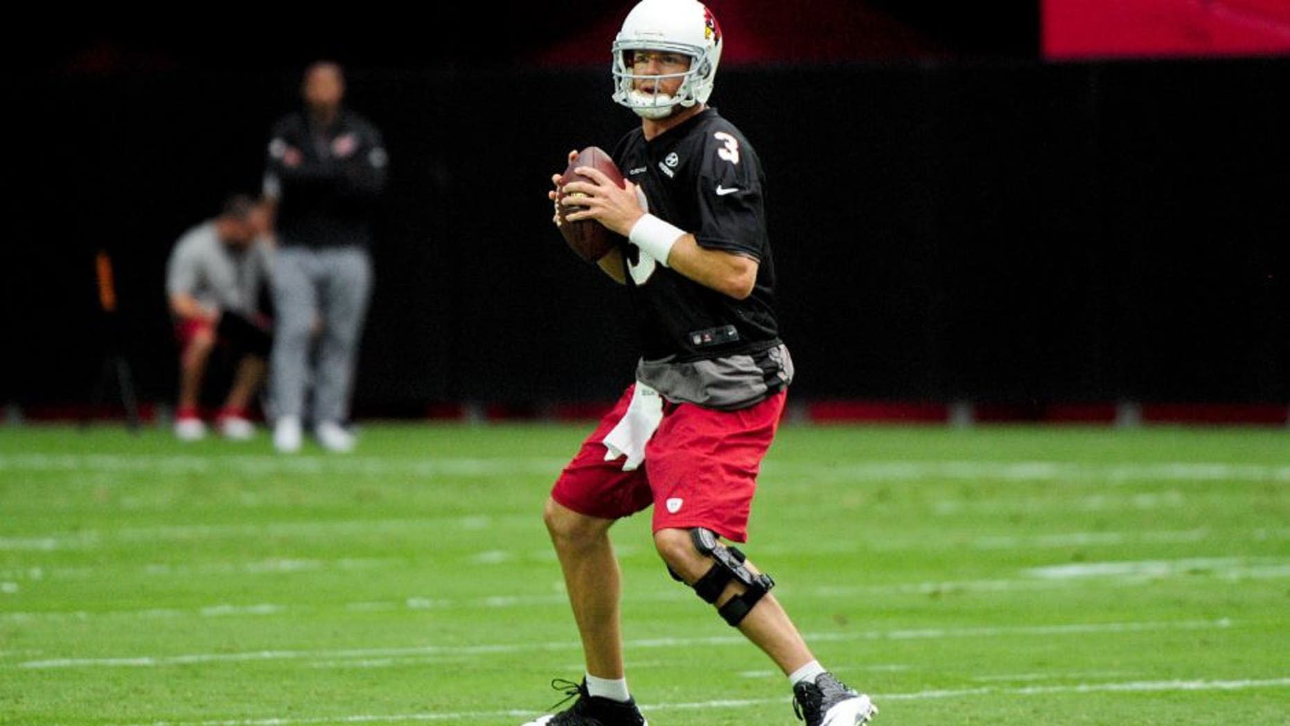 Aug 1, 2015; Glendale, AZ, USA; Arizona Cardinals quarterback Carson Palmer (3) throws during training camp at University of Phoenix. Mandatory Credit: Matt Kartozian-USA TODAY Sports