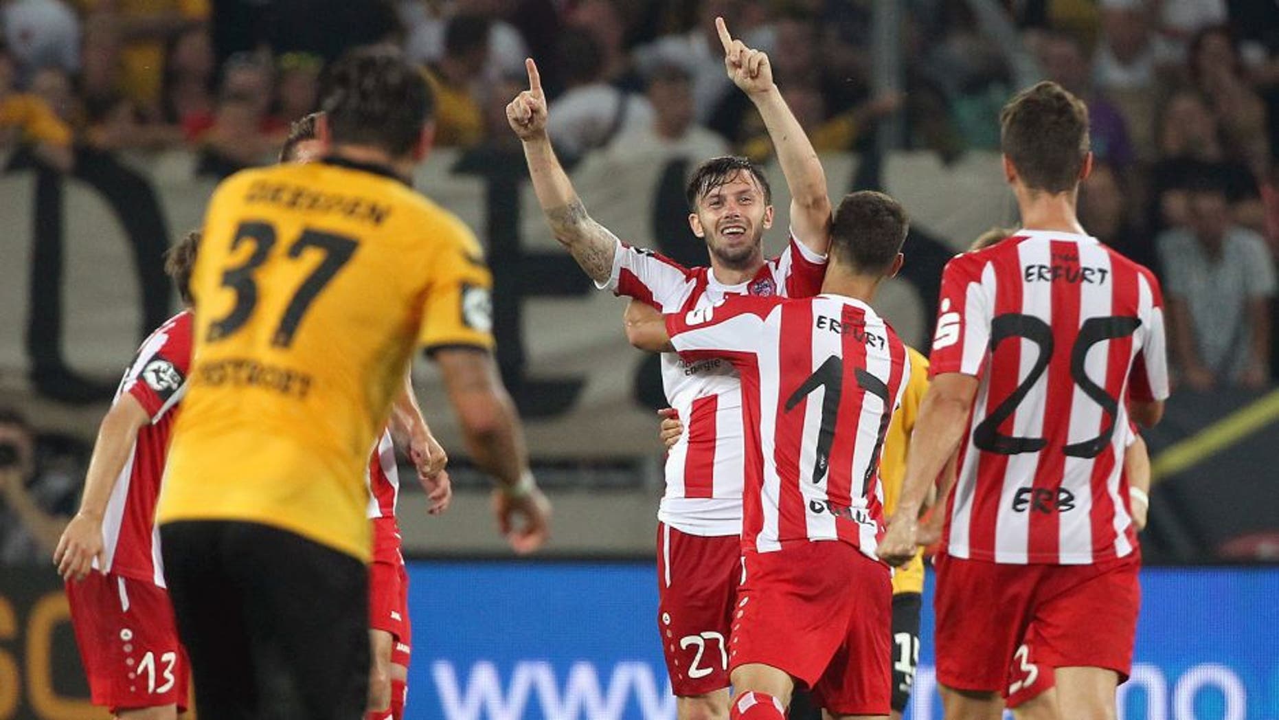 DRESDEN, GERMANY - AUGUST 13: Carsten Kammlott of Erfurt celebrates the second goal with teammates during the Third League match between SG Dynamo Dresden and FC Rot-Weiss Erfurt at Gl¸cksgas-Stadion on August 13, 2015 in Dresden, Germany. (Photo by Karina Hessland/Bongarts/Getty Images)