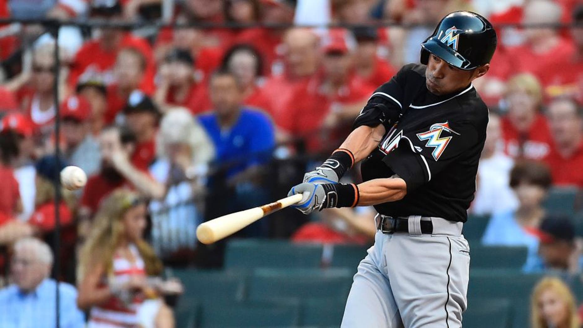 Aug 15, 2015; St. Louis, MO, USA; Miami Marlins left fielder Ichiro Suzuki (51) hits a single off of St. Louis Cardinals starting pitcher John Lackey (not pictured) in the first inning at Busch Stadium. Mandatory Credit: Jasen Vinlove-USA TODAY Sports