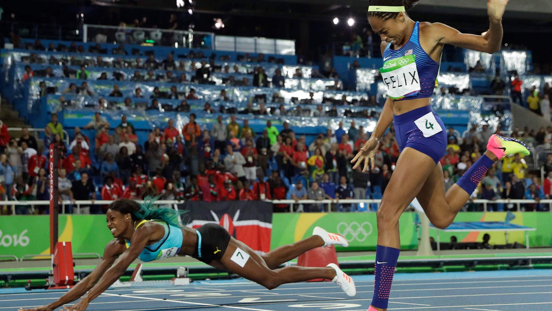 Aug.15, 2016: Bahamas' Shaunae Miller falls over the finish line to win gold ahead of United States' Allyson Felix, right, in the women's 400-meter final during the athletics competitions of the 2016 Summer Olympics at the Olympic stadium in Rio de Janeiro, Brazil.