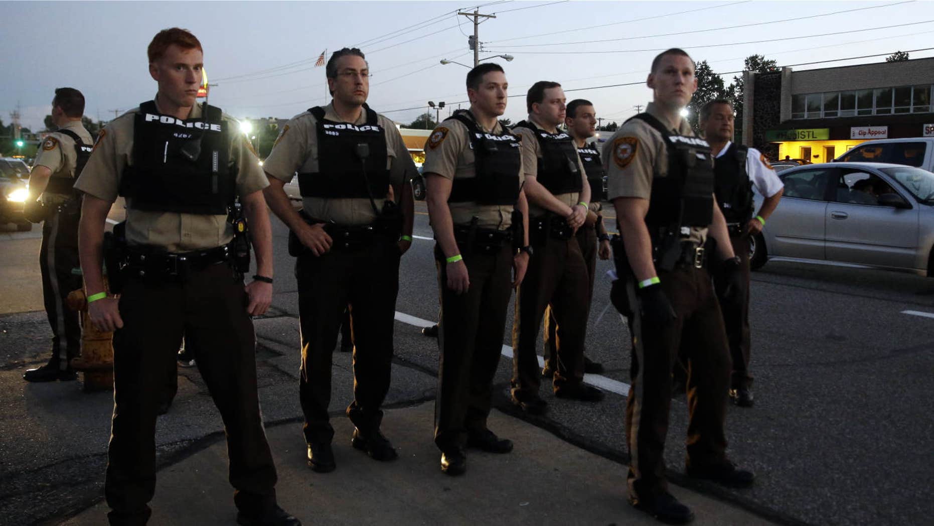 Aug. 10, 2015: Police patrol in Ferguson, Mo