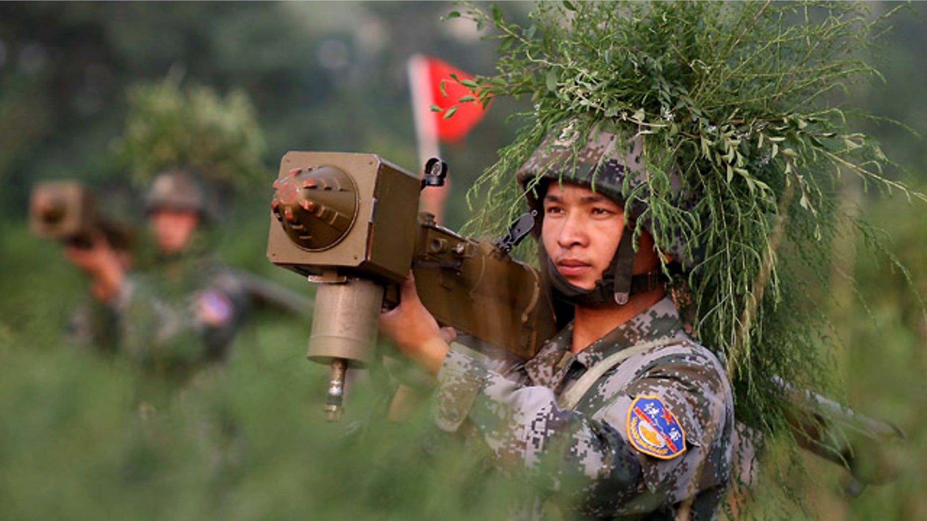 Aug. 4: Chinese soldiers take part in the Vanguard 2010 live-fire air defense exercise in central China's Henan Province.