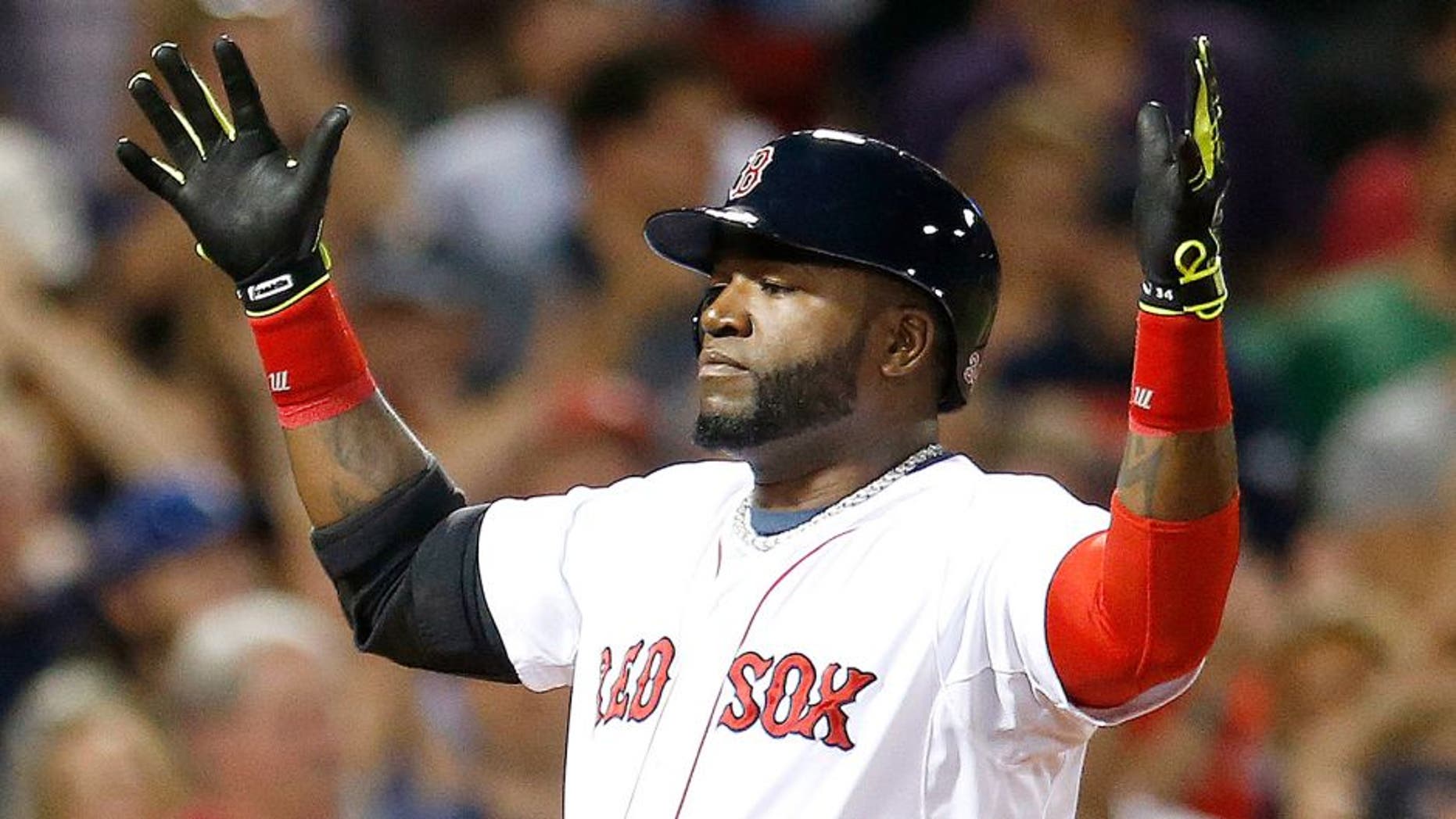 Boston Red Sox's David Ortiz celebrates his two-run home run during the third inning of a baseball game against the Houston Astros in Boston, Saturday, Aug. 16, 2014. (AP Photo/Michael Dwyer)