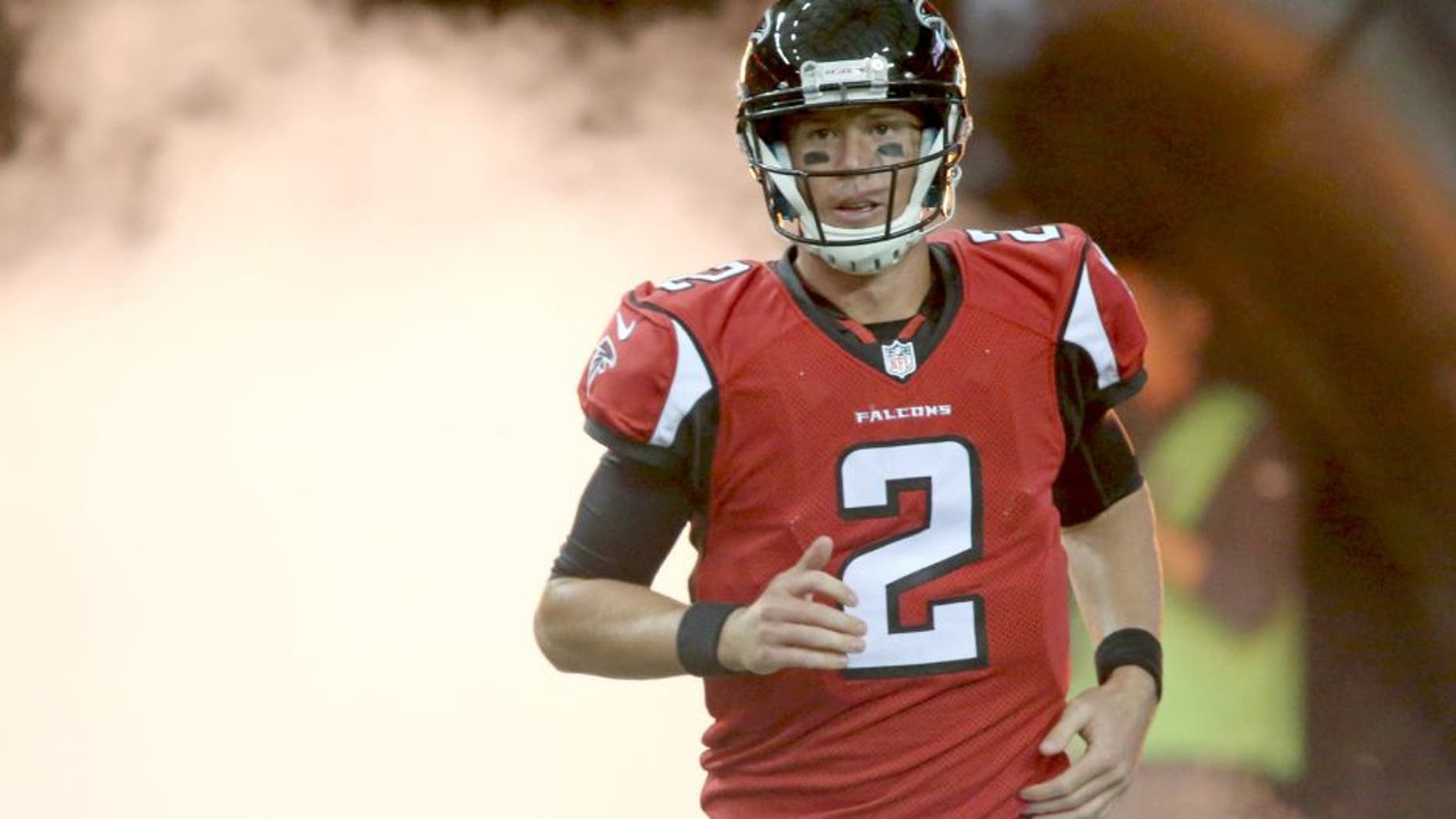Aug 14, 2015; Atlanta, GA, USA; Atlanta Falcons quarterback Matt Ryan (2) runs onto the field before their game against the Tennessee Titans in a preseason NFL football game at Georgia Dome. Mandatory Credit: Jason Getz-USA TODAY Sports
