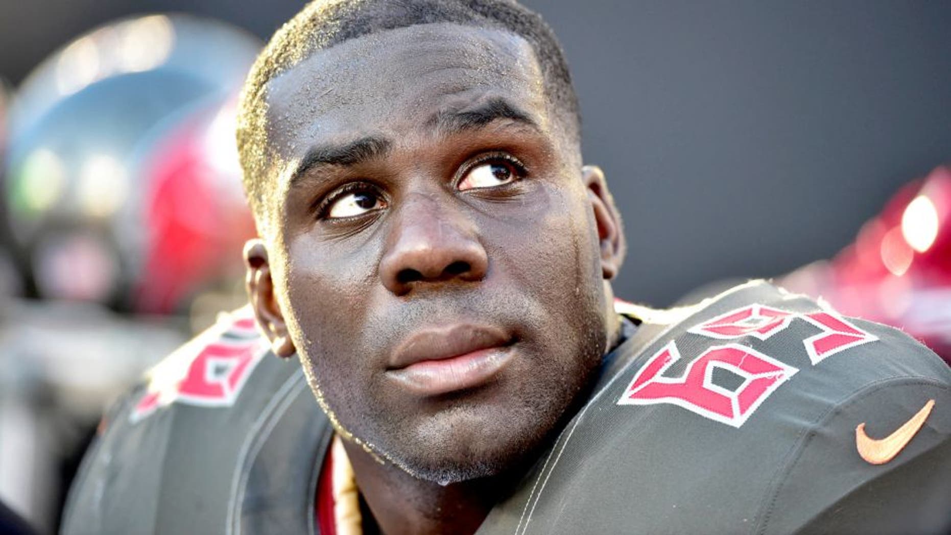 Dec 14, 2014; Charlotte, NC, USA; Tampa Bay Buccaneers tackle Demar Dotson (69) on the sidelines in the fourth quarter. The Panthers defeated the Buccaneers 19-17 at Bank of America Stadium. Mandatory Credit: Bob Donnan-USA TODAY Sports