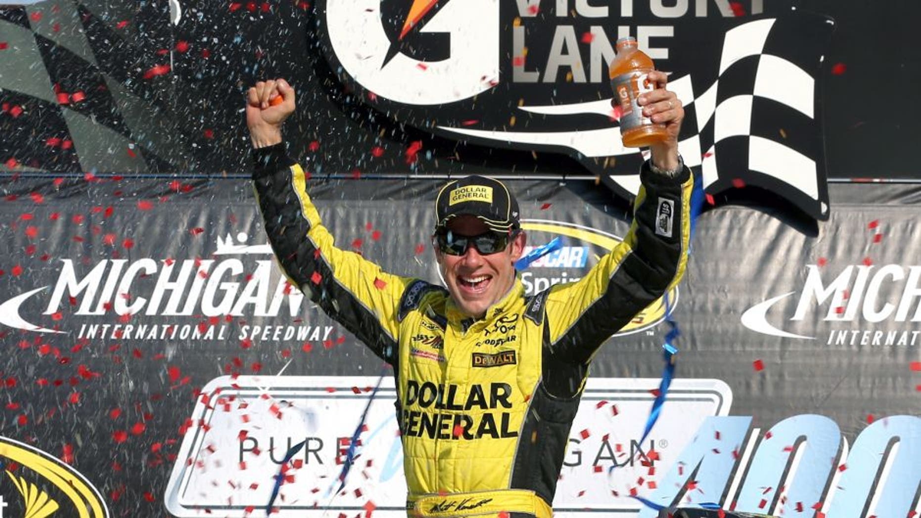 BROOKLYN, MI - AUGUST 16: Matt Kenseth, driver of the #20 Dollar General Toyota, celebrates in victory lane after winning the NASCAR Sprint Cup Series Pure Michigan 400 at Michigan International Speedway on August 16, 2015 in Brooklyn, Michigan. (Photo by Nick Laham/NASCAR via Getty Images)
