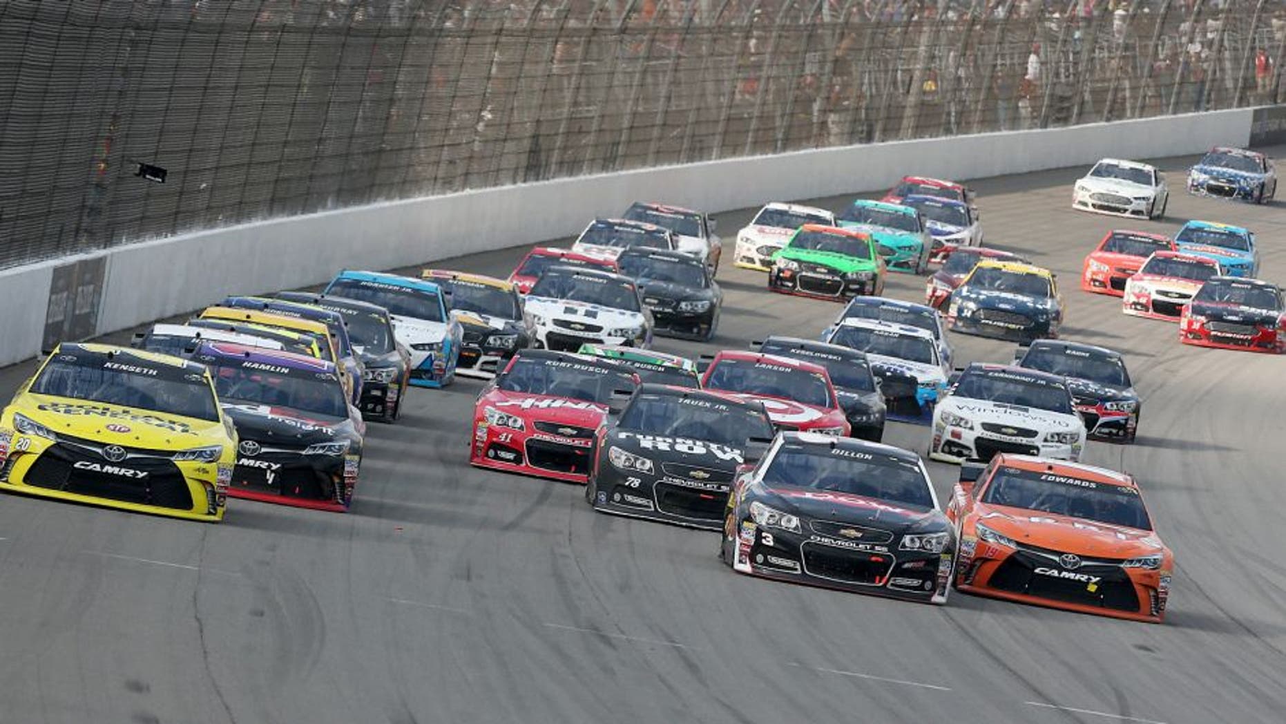 BROOKLYN, MI - AUGUST 16: Matt Kenseth, driver of the #20 Dollar General Toyota, and Austin Dillon, driver of the #3 Dow Chevrolet, lead the field on a restart during the NASCAR Sprint Cup Series Pure Michigan 400 at Michigan International Speedway on August 16, 2015 in Brooklyn, Michigan. (Photo by Nick Laham/NASCAR via Getty Images)