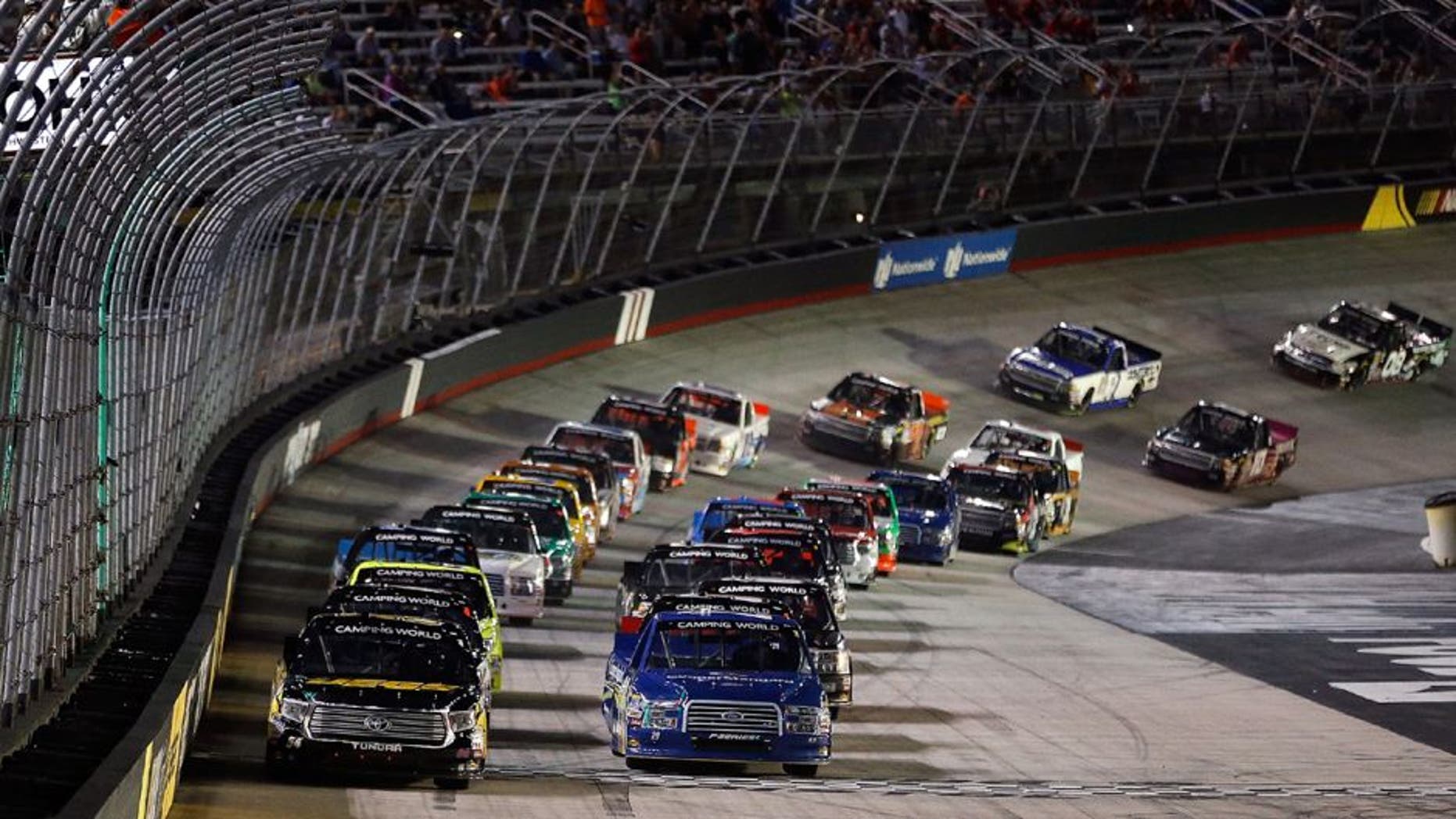 BRISTOL, TN - AUGUST 19: Kyle Busch, driver of the #54 JEGS Toyota, and Ryan Blaney, driver of the #29 Coopers Stard Ford, take the green flag during the NASCAR Camping World Truck Series UNOH 200 race, at Bristol Motor Speedway on August 19, 2015 in Bristol, Tennessee. (Photo by Brian Lawdermilk/NASCAR via Getty Images)