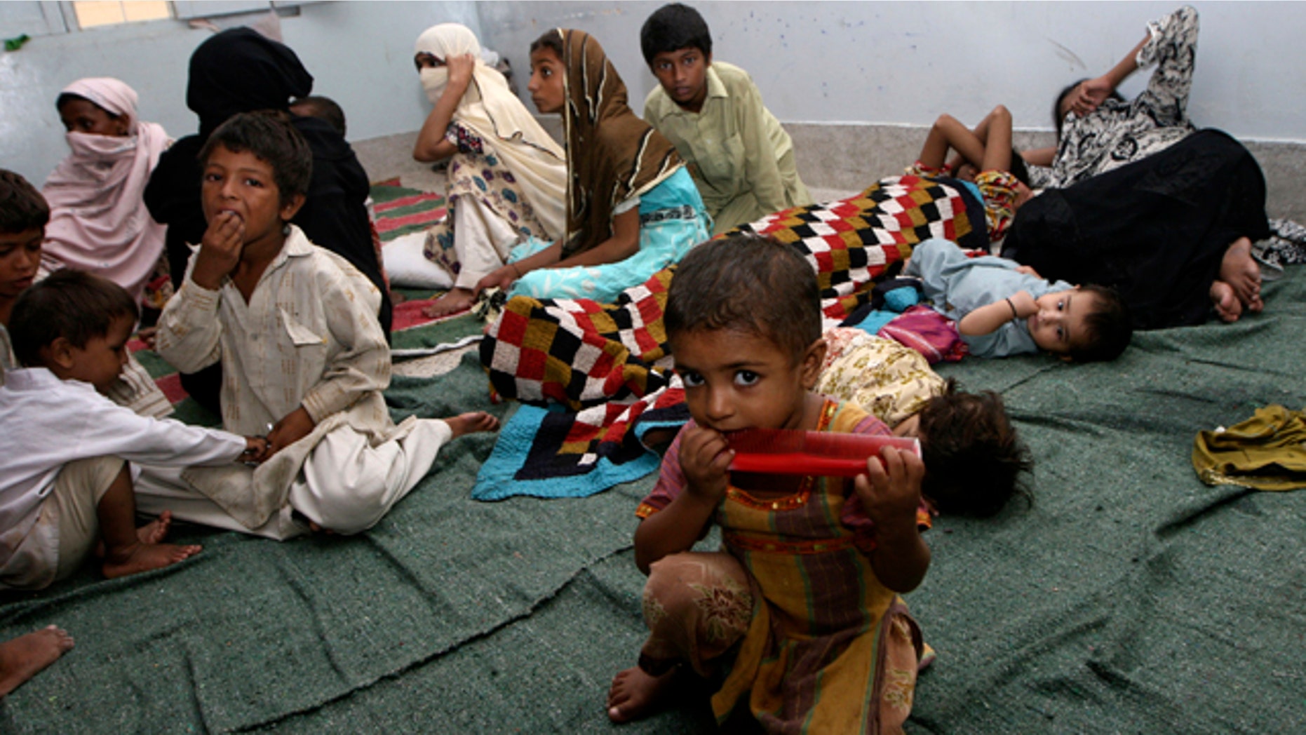 Aug. 17: Residents displaced by heavy floods take shelter in a camp in Karachi, Pakistan.