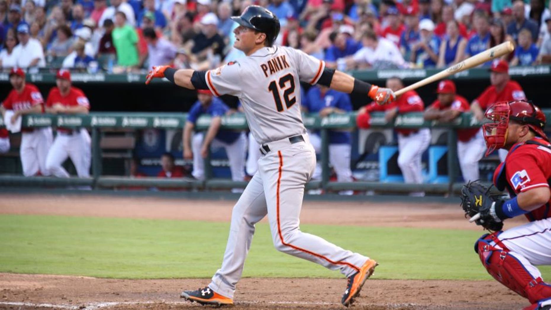 ARLINGTON, TX - AUGUST 1: Bobby Wilson #8 of the Texas Rangers looks on as Joe Panik #12 of the San Francisco Giants hits a double RBI the third inning at Globe Life Park in Arlington on August 1, 2015 in Arlington, Texas. (Photo by Rick Yeatts/Getty Images)