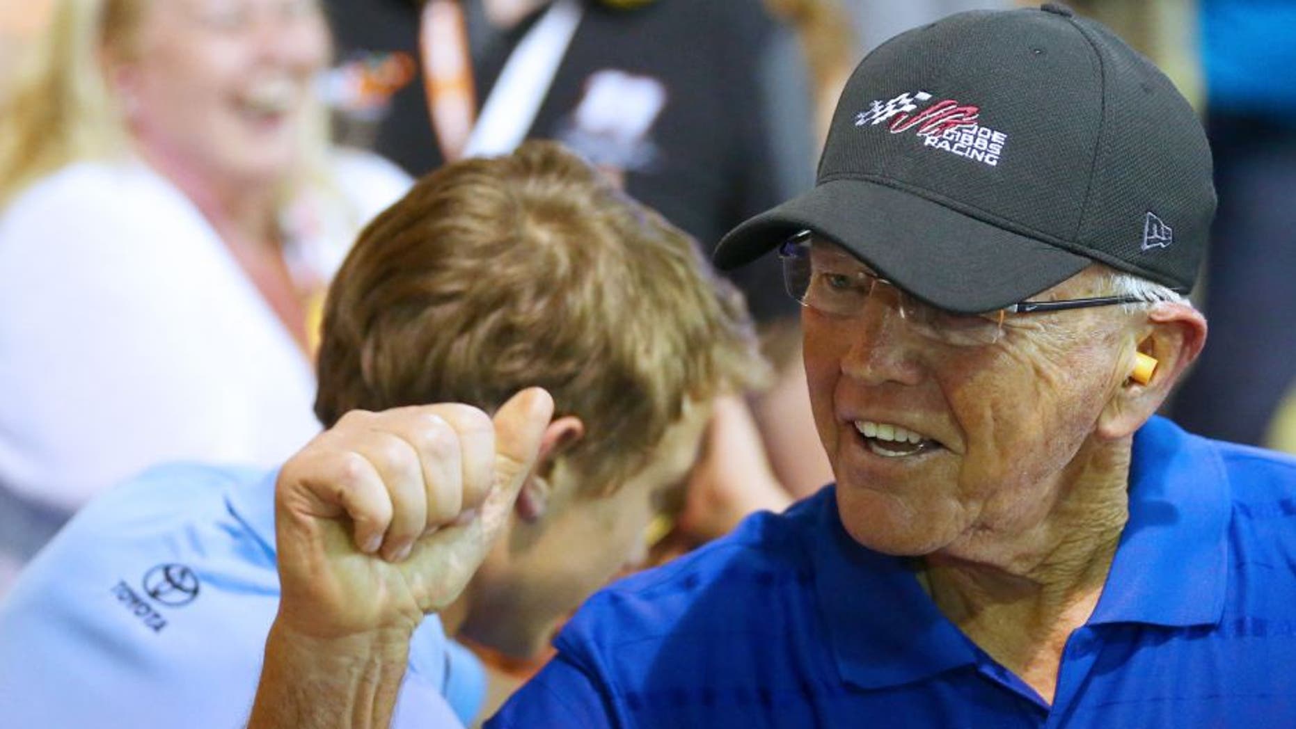 Team owner Joe Gibbs celebrates after Carl Edwards, driver of the #19 Subway Toyota, wins the NASCAR Sprint Cup Series Coca-Cola 600 at Charlotte Motor Speedway on May 24, 2015 in Charlotte, North Carolina. (Photo by Sarah Crabill/NASCAR via Getty Images)