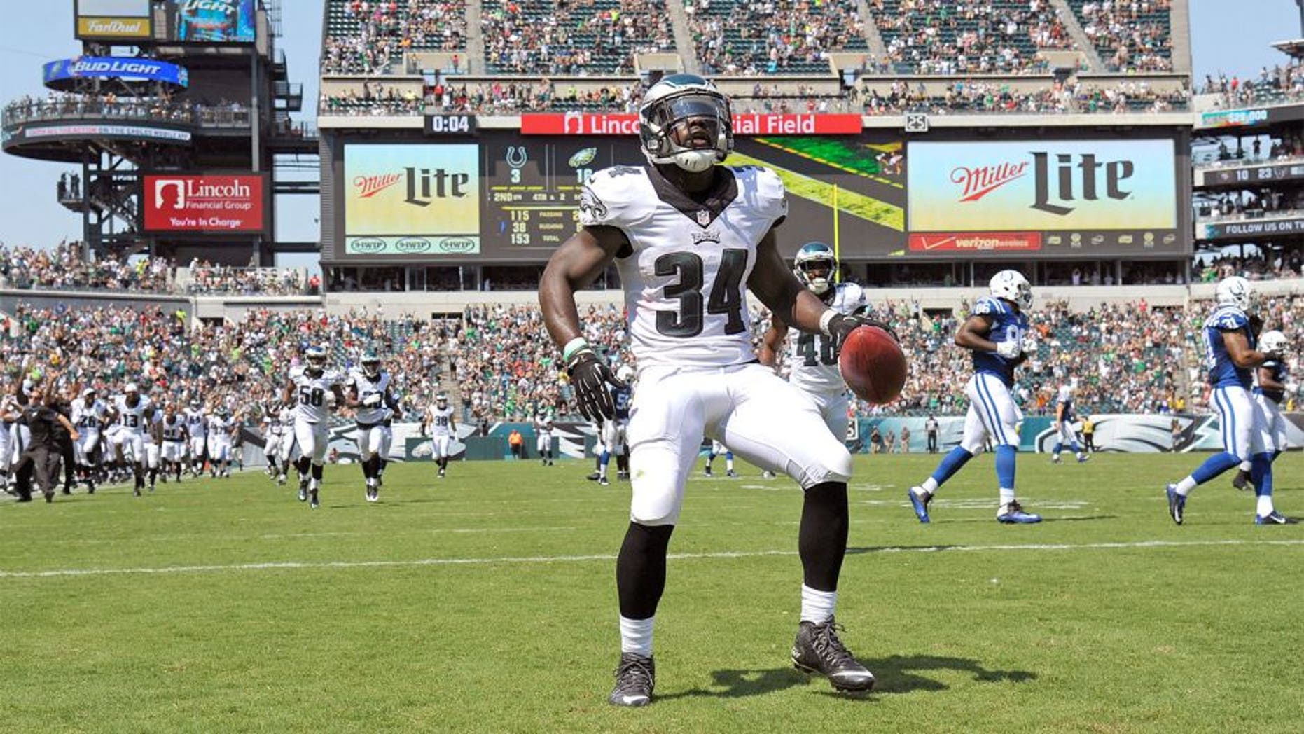 Aug 16, 2015; Philadelphia, PA, USA; Philadelphia Eagles running back Kenjon Barner (34) celebrates after scoring a 94-yard punt return touchdown during the second quarter against the Indianapolis Colts in a preseason NFL football game at Lincoln Financial Field. Mandatory Credit: Eric Hartline-USA TODAY Sports