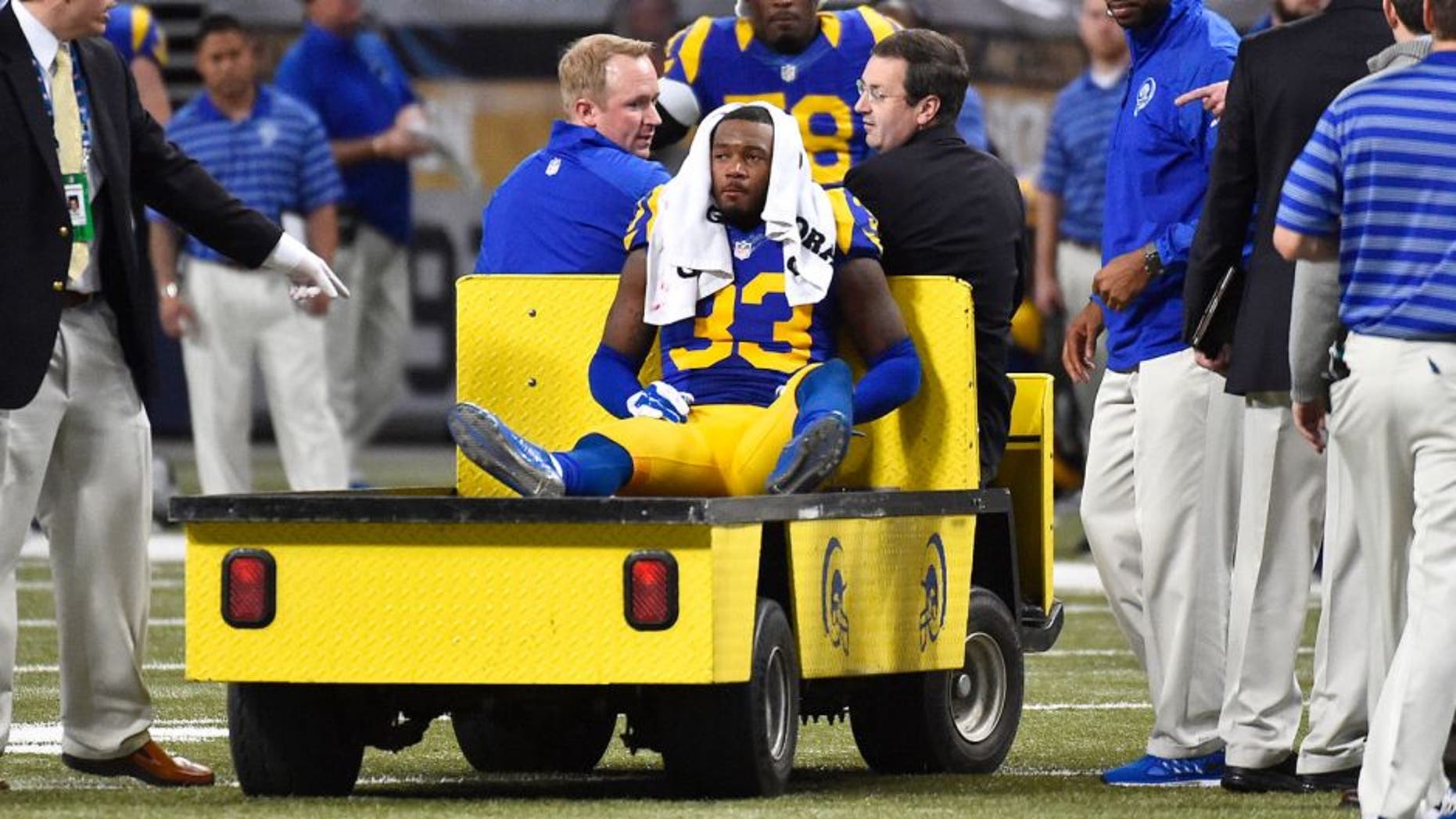 Dec 21, 2014; St. Louis, MO, USA; St. Louis Rams cornerback E.J. Gaines (33) is carted off the field after being injured against the New York Giants during the second half at the Edward Jones Dome. The New York Giants defeat the St. Louis Rams 37-27. Mandatory Credit: Jasen Vinlove-USA TODAY Sports