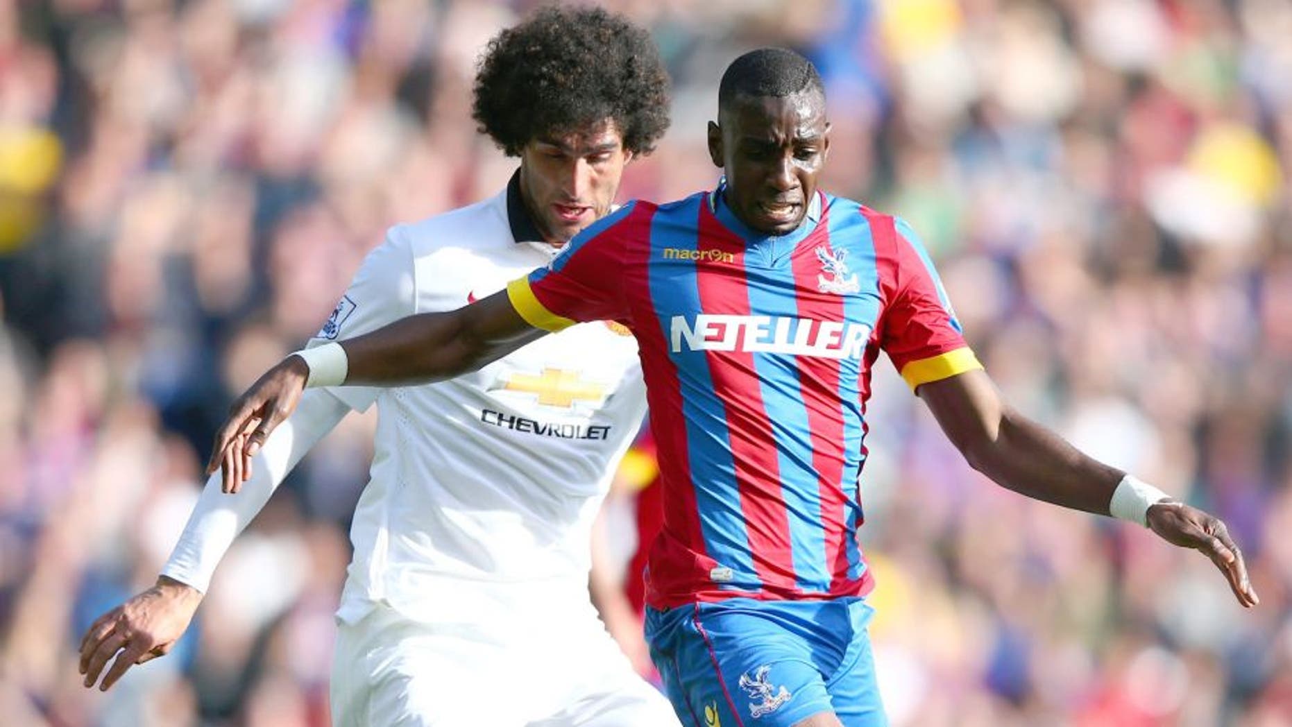 LONDON, ENGLAND - MAY 09: Yannick Bolasie of Crystal Palace is tackled by Marouane Fellaini of Manchester United during the Barclays Premier League match between Crystal Palace and Manchester United at Selhurst Park on May 9, 2015 in London, England. (Photo by Ian Walton/Getty Images)