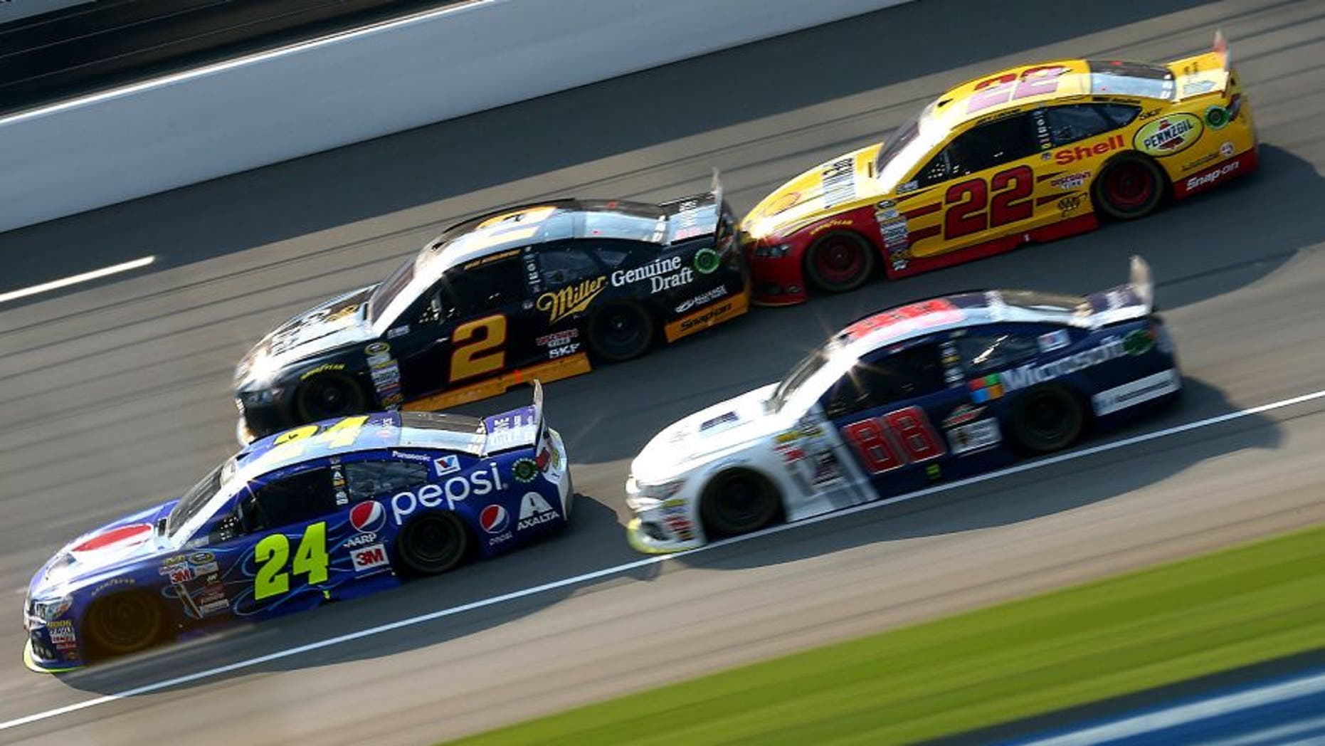 BROOKLYN, MI - AUGUST 16: Jeff Gordon, driver of the #24 Pepsi Chevrolet, Dale Earnhardt Jr., driver of the #88 Microsoft Chevrolet, Brad Keselowski, driver of the #2 Miller Lite Ford, and Joey Logano, driver of the #22 Shell Pennzoil Ford, race during the NASCAR Sprint Cup Series Pure Michigan 400 at Michigan International Speedway on August 16, 2015 in Brooklyn, Michigan. (Photo by Sarah Crabill/Getty Images)