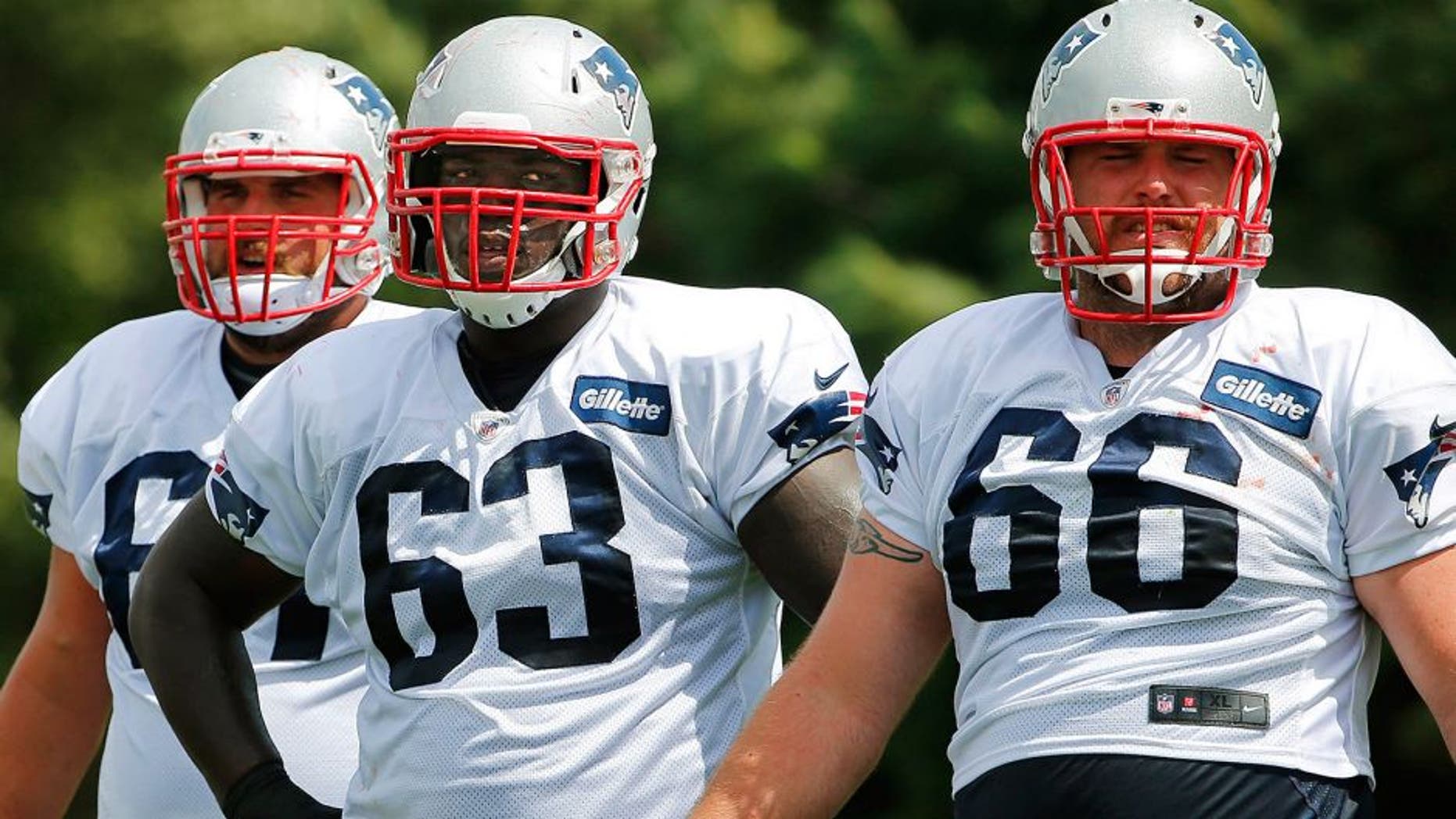 Aug 6, 2015; Foxborough, MA, USA; New England Patriots offensive guard Tre Jackson (63) with guard Josh Kline (67) and center Bryan Stork (66) during training camp at Gillette Stadium. Mandatory Credit: Winslow Townson-USA TODAY Sports