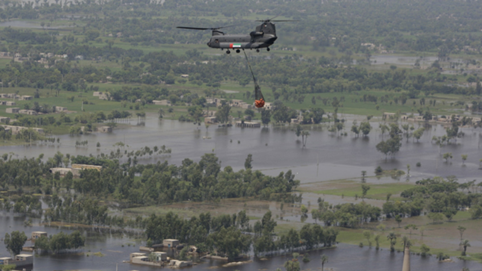 Aug. 18: A United Arab Emirates Chinook carries food supply over Punjab province. Pakistan senior meteorologist Arif Mahmood said floodwaters won't fully recede until the end of the month, and existing river torrents were still heading toward major cities in the country's south.