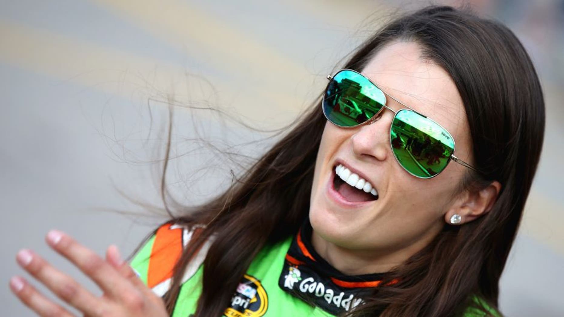 Danica Patrick, driver of the #10 GoDaddy Chevrolet, stands on the grid during qualifying for the NASCAR Sprint Cup Series Pure Michigan 400 at Michigan International Speedway on August 14, 2015 in Brooklyn, Michigan. (Photo by Sean Gardner/NASCAR via Getty Images)