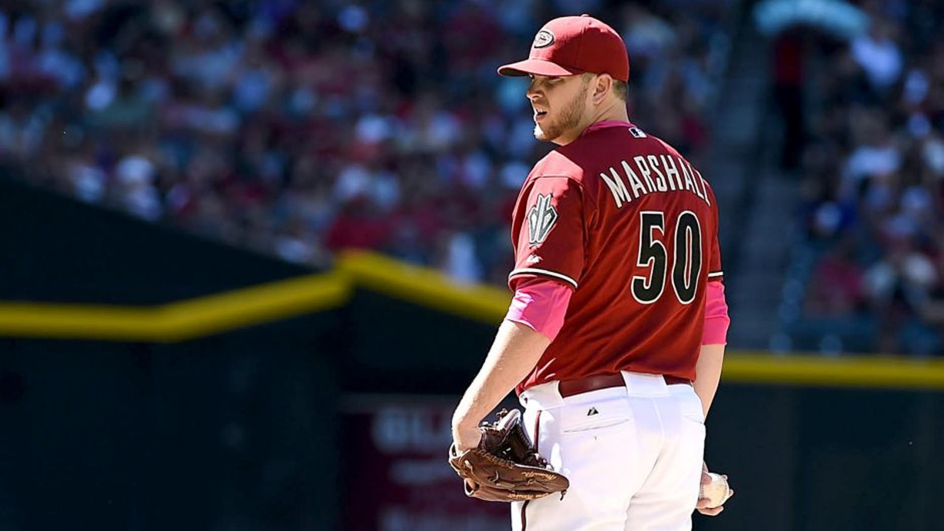 PHOENIX, AZ - MAY 10: Evan Marshall #50 of the Arizona Diamondbacks delivers a pitch against the San Diego Padres at Chase Field on May 10, 2015 in Phoenix, Arizona. (Photo by Norm Hall/Getty Images)