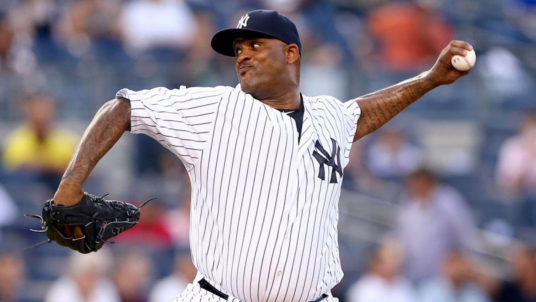 NEW YORK, NY - AUGUST 18: CC Sabathia #52 of the New York Yankees delivers a pitch in the first inning against the Minnesota Twins on August 18, 2015 at Yankee Stadium in the Bronx borough of New York City. (Photo by Elsa/Getty Images)
