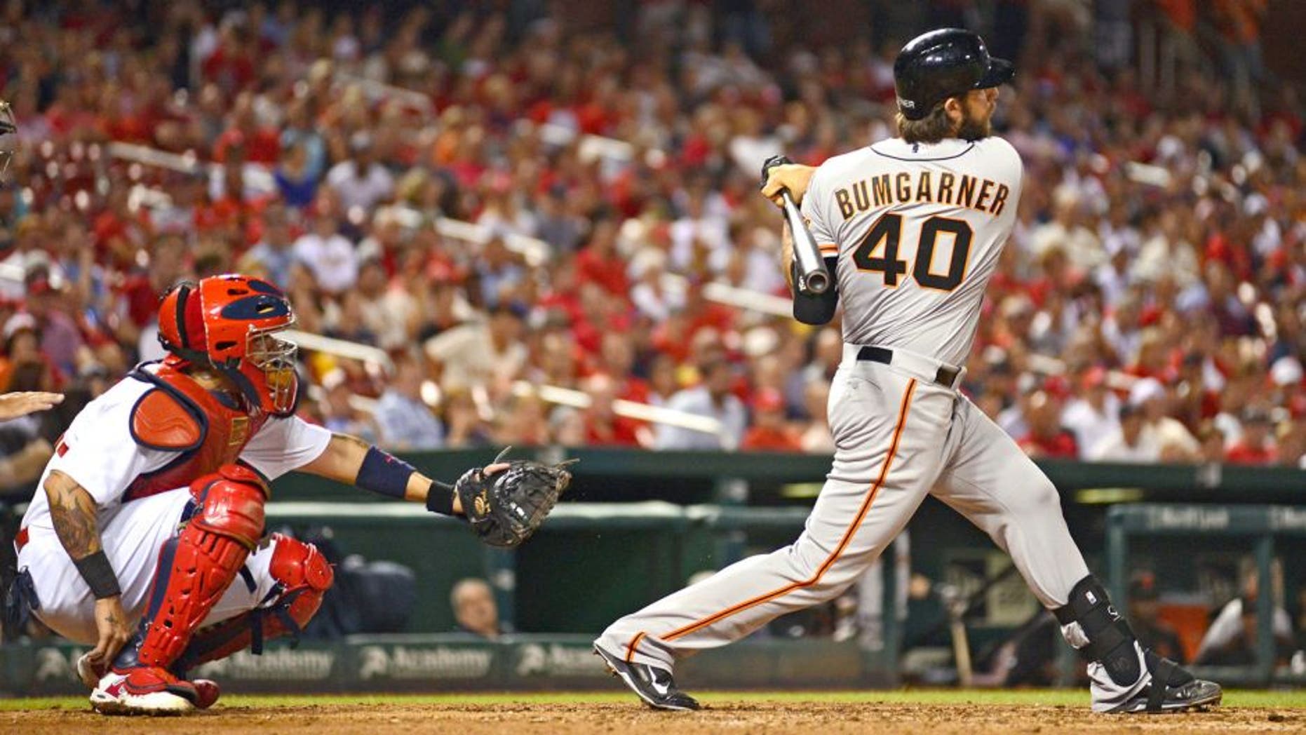 Aug 18, 2015; St. Louis, MO, USA; San Francisco Giants pinch hitter Madison Bumgarner (40) hit s a single off of St. Louis Cardinals starting pitcher Lance Lynn (not pictured) during the seventh inning at Busch Stadium. Mandatory Credit: Jeff Curry-USA TODAY Sports