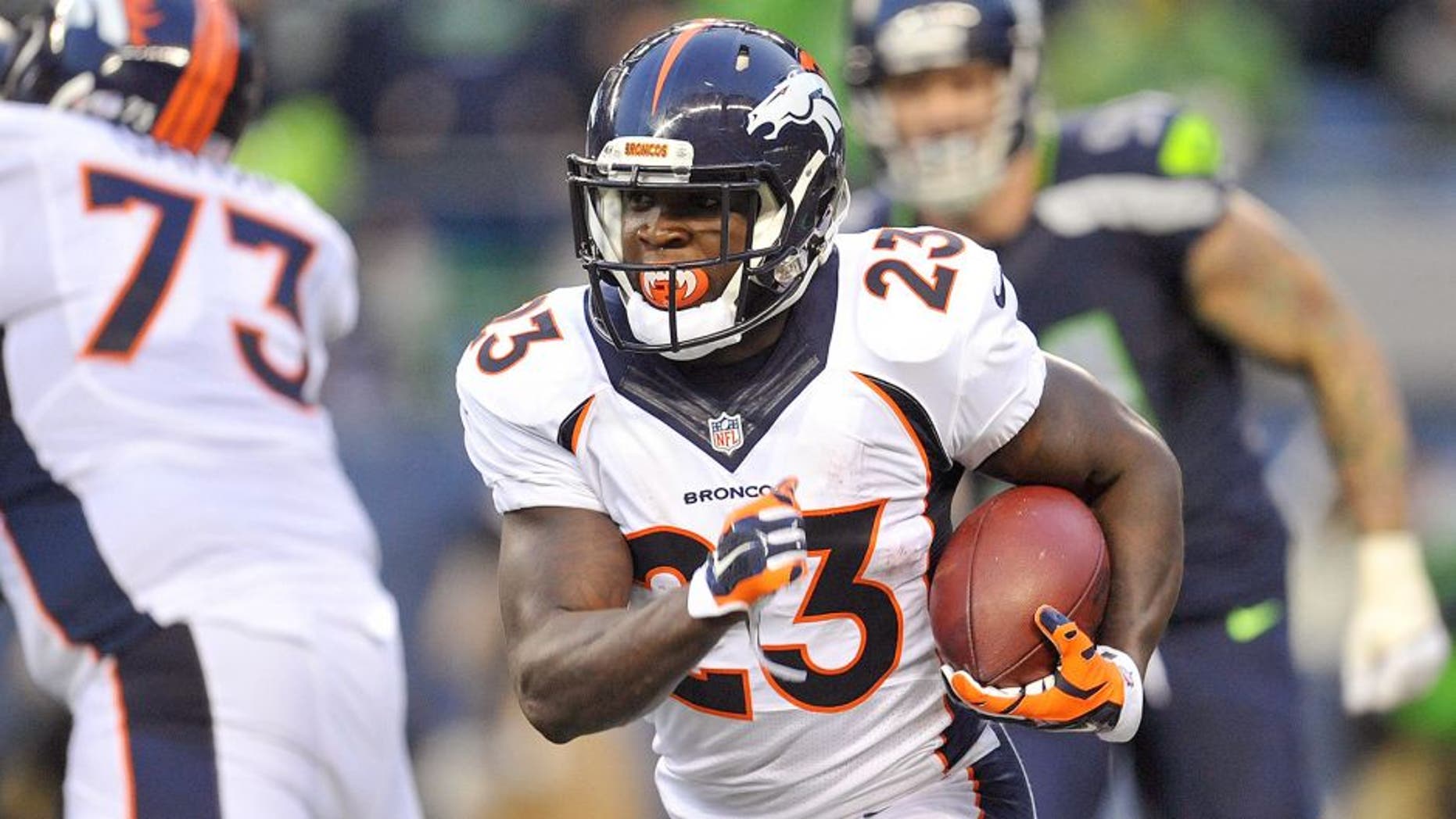 August 14, 2015; Seattle, WA, USA; Denver Broncos running back Ronnie Hillman (23) runs the ball against the Seattle Seahawks during the first half in a preseason NFL football game at CenturyLink Field. Mandatory Credit: Gary A. Vasquez-USA TODAY Sports