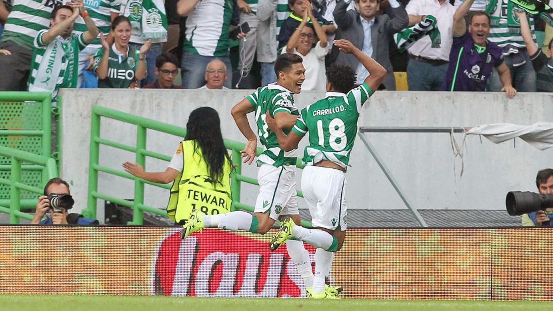 LISBON, PORTUGAL - AUGUST 18: Sporting's forward Teofilo Gutierrez celebrates scoring a goal with Sporting's forward Andre Carrillo during the UEFA Champions League qualifying round play-off first leg match between Sporting CP and CSKA Moscow at Estadio Jose Alvalade on August 18, 2015 in Lisbon, Portugal. (Photo by Carlos Rodrigues/Getty Images)