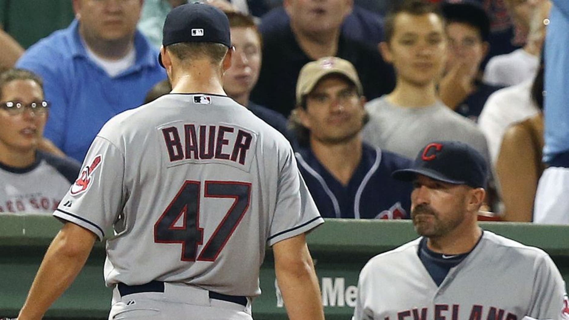 Trevor Bauer leaves the baseball game after being taken out during the second inning after giving up five runs vs. the Boston Red Sox