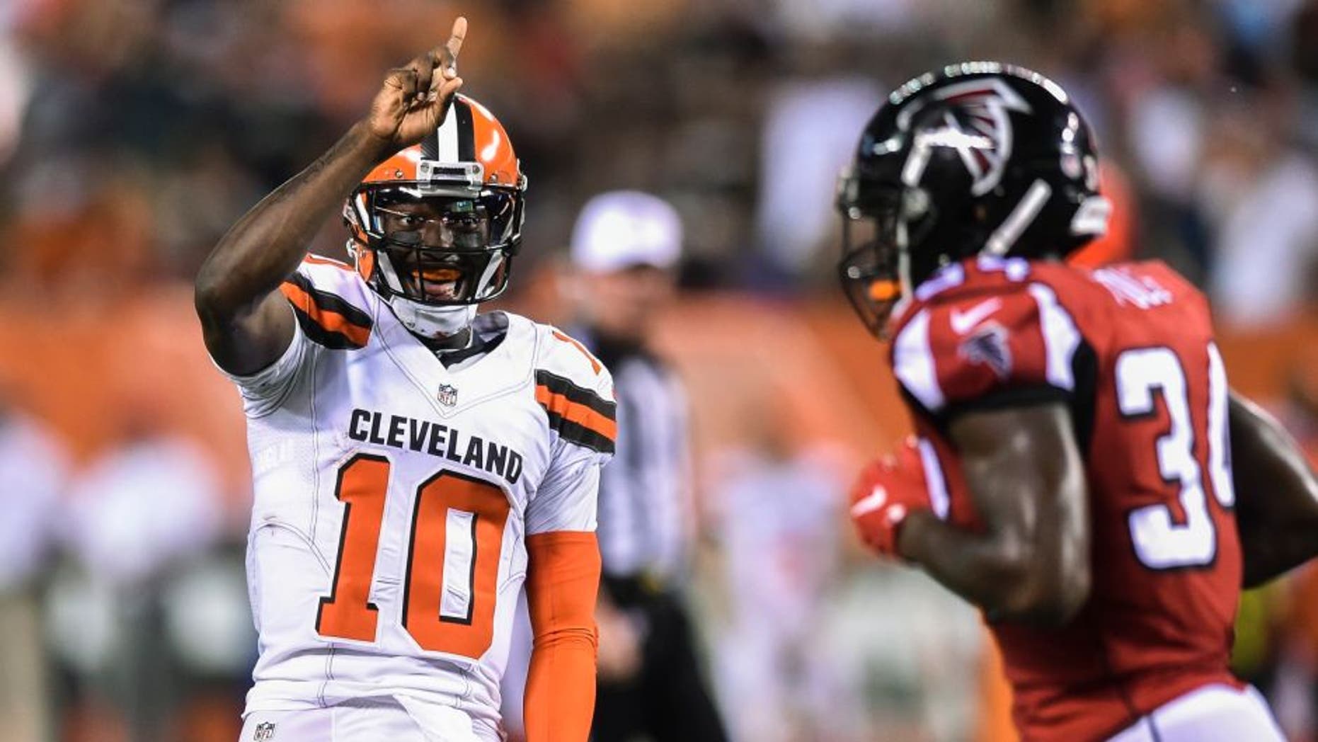 Cleveland Browns quarterback Robert Griffin III (10) reacts after tight end Gary Barnidge scored a touchdown during the first half of an NFL preseason football game against the Atlanta Falcons, Thursday, Aug. 18, 2016, in Cleveland. (AP Photo/David Richard)