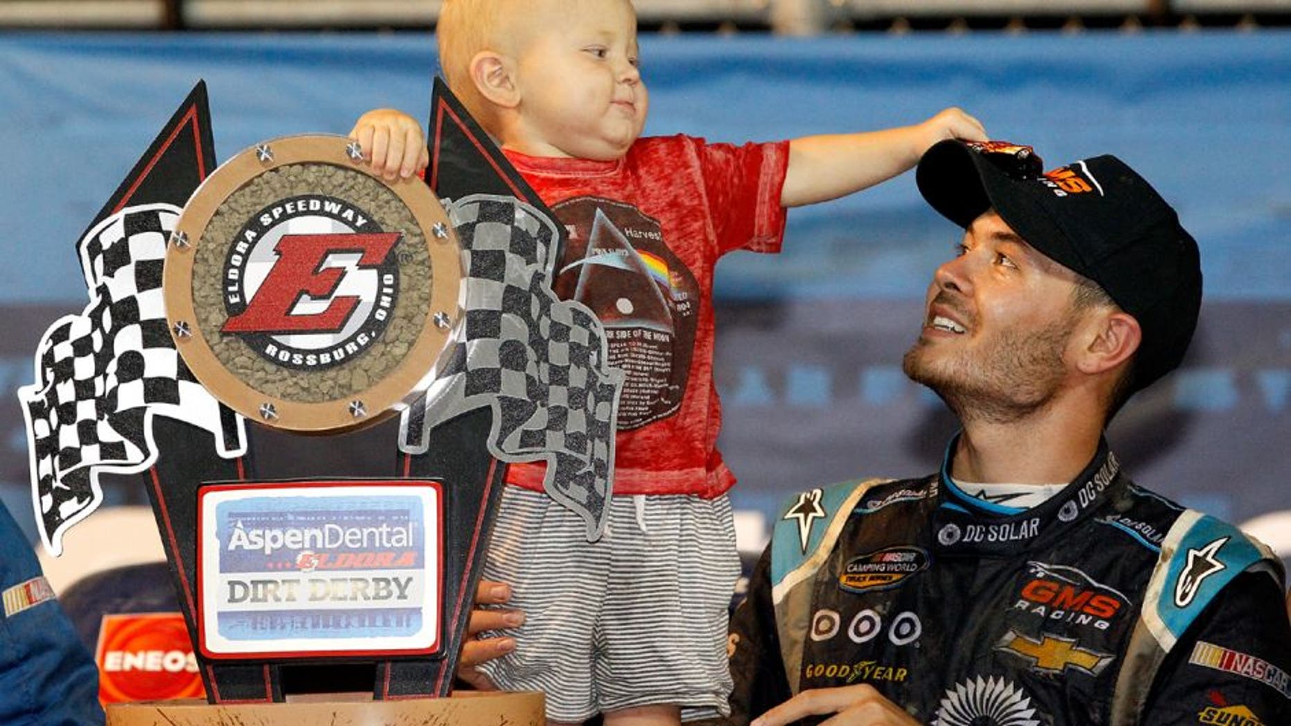 ROSSBURG, OH - JULY 20: Kyle Larson, driver of the #24 DC Solar Chevrolet, and his son Owen Larson hold the NASCAR Camping World Series 4th Annual Aspen Dental Eldora Dirt Derby 150 trophy after winning at Eldora Speedway on July 20, 2016 in Rossburg, Ohio. (Photo by Brian Lawdermilk/Getty Images)