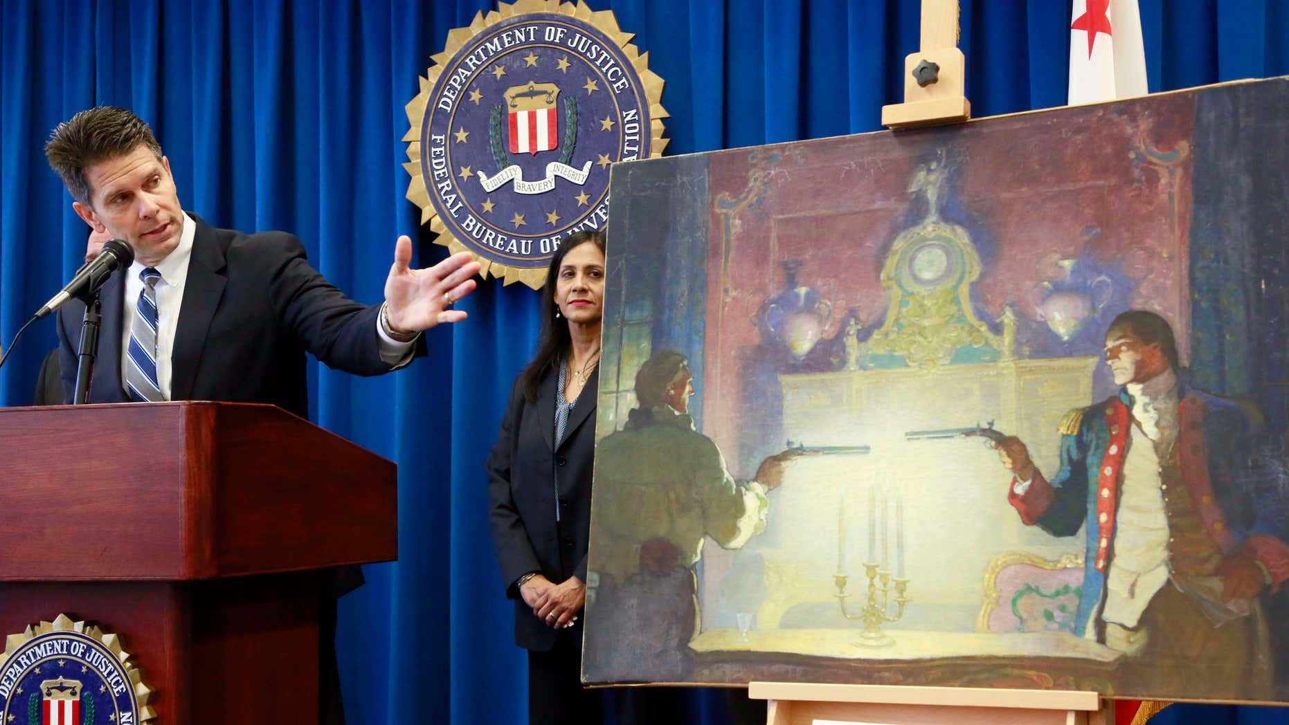 Aug. 18, 2015: David Bowdich FBI Assistant Director in Charge, left, and and FBI Special Agent Elizabeth Rivas speak at a news conference in Los Angeles.