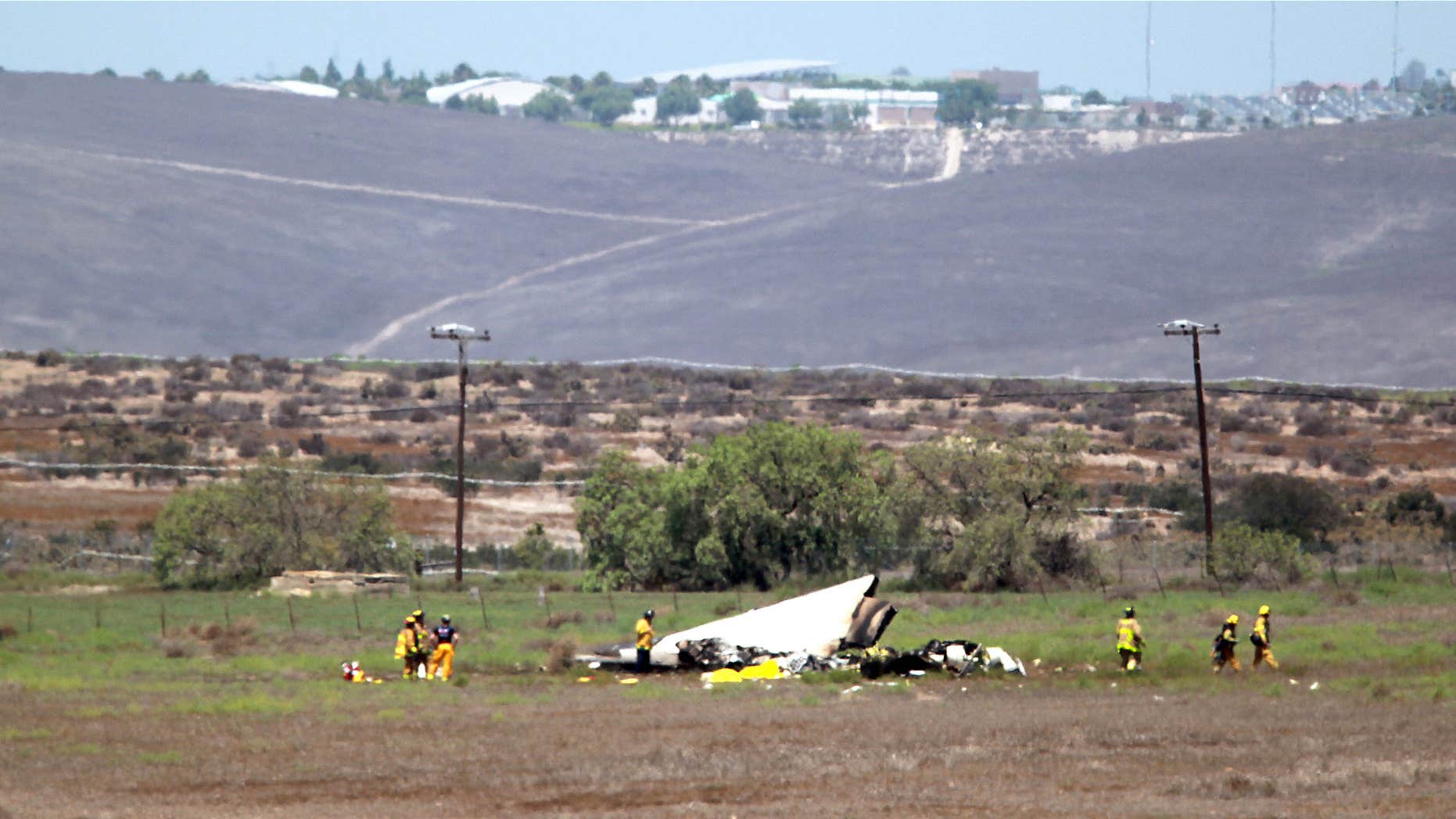 Aug. 16, 2015: Authorities say multiple people died following the midair collision and crash of two small planes near an airport in southern San Diego County.