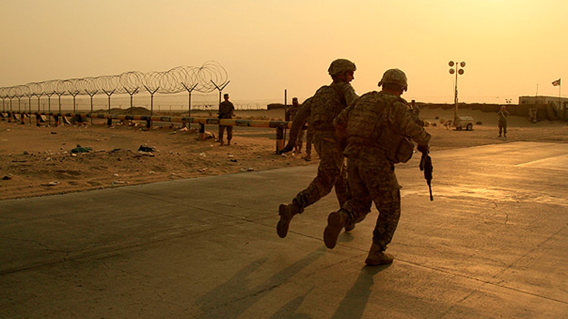 Aug. 18: U.S. Army soldiers from 2nd Battalion, 23rd Infantry Regiment, 4th Brigade, 2nd Infantry Division race toward the border from Iraq into Kuwait.