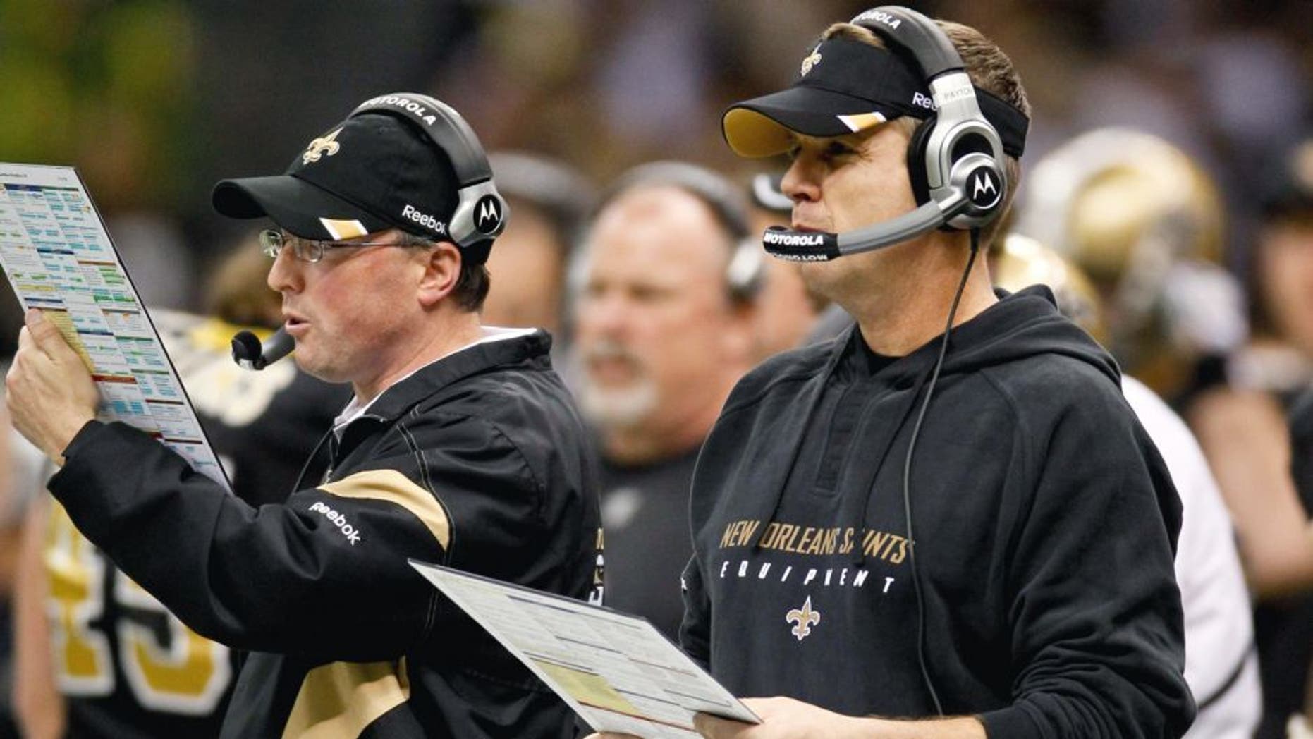 January 1, 2012; New Orleans, LA, USA; New Orleans Saints head coach Sean Payton and offensive coordinator Pete Carmichael on the sideline during the third quarter of a game against the Carolina Panthers at the Mercedes-Benz Superdome. Mandatory Credit: Derick E. Hingle-USA TODAY Sports