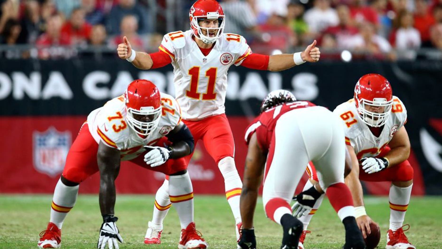 Aug 15, 2015; Glendale, AZ, USA; Kansas City Chiefs quarterback Alex Smith (11) reacts as he calls a play against the Arizona Cardinals during a preseason NFL football game at University of Phoenix Stadium. Mandatory Credit: Mark J. Rebilas-USA TODAY Sports
