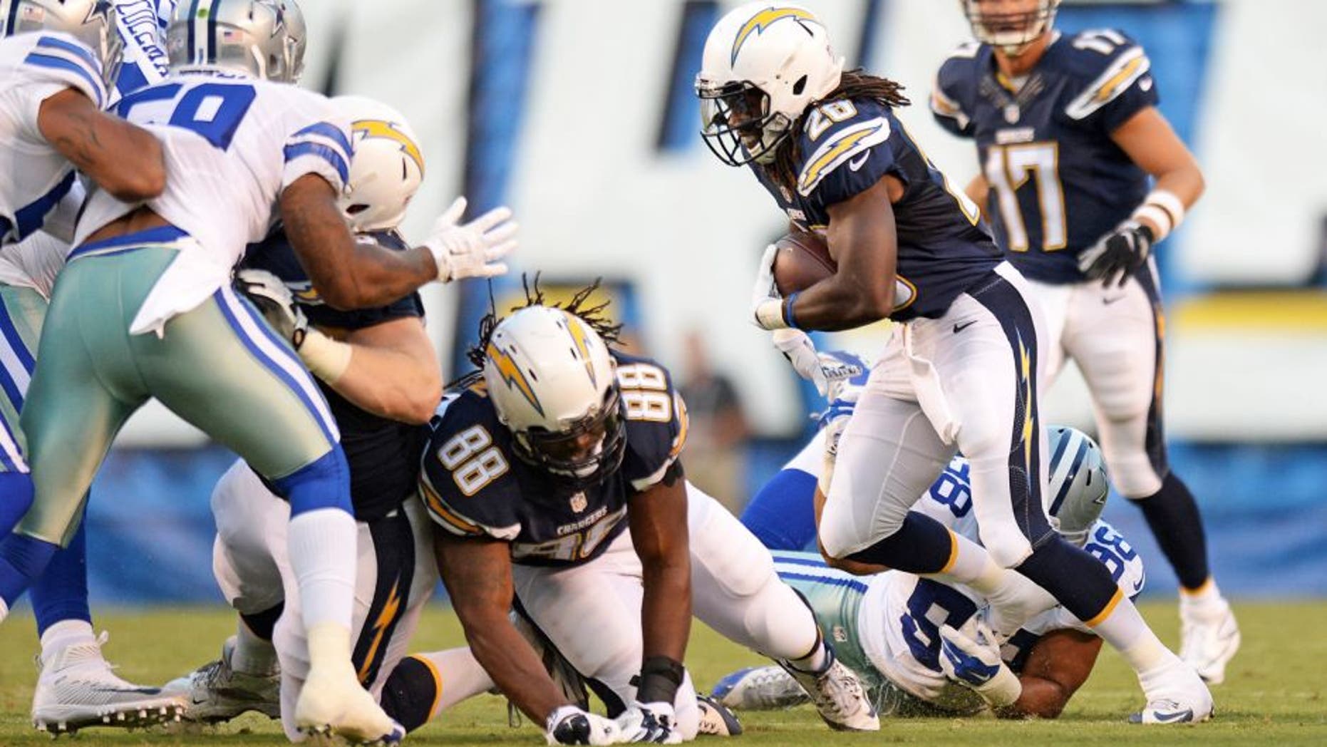 Aug 13, 2015; San Diego, CA, USA; San Diego Chargers running back Melvin Gordon (28) runs against the Dallas Cowboys during the first quarter in a preseason NFL football game at Qualcomm Stadium. Mandatory Credit: Jake Roth-USA TODAY Sports